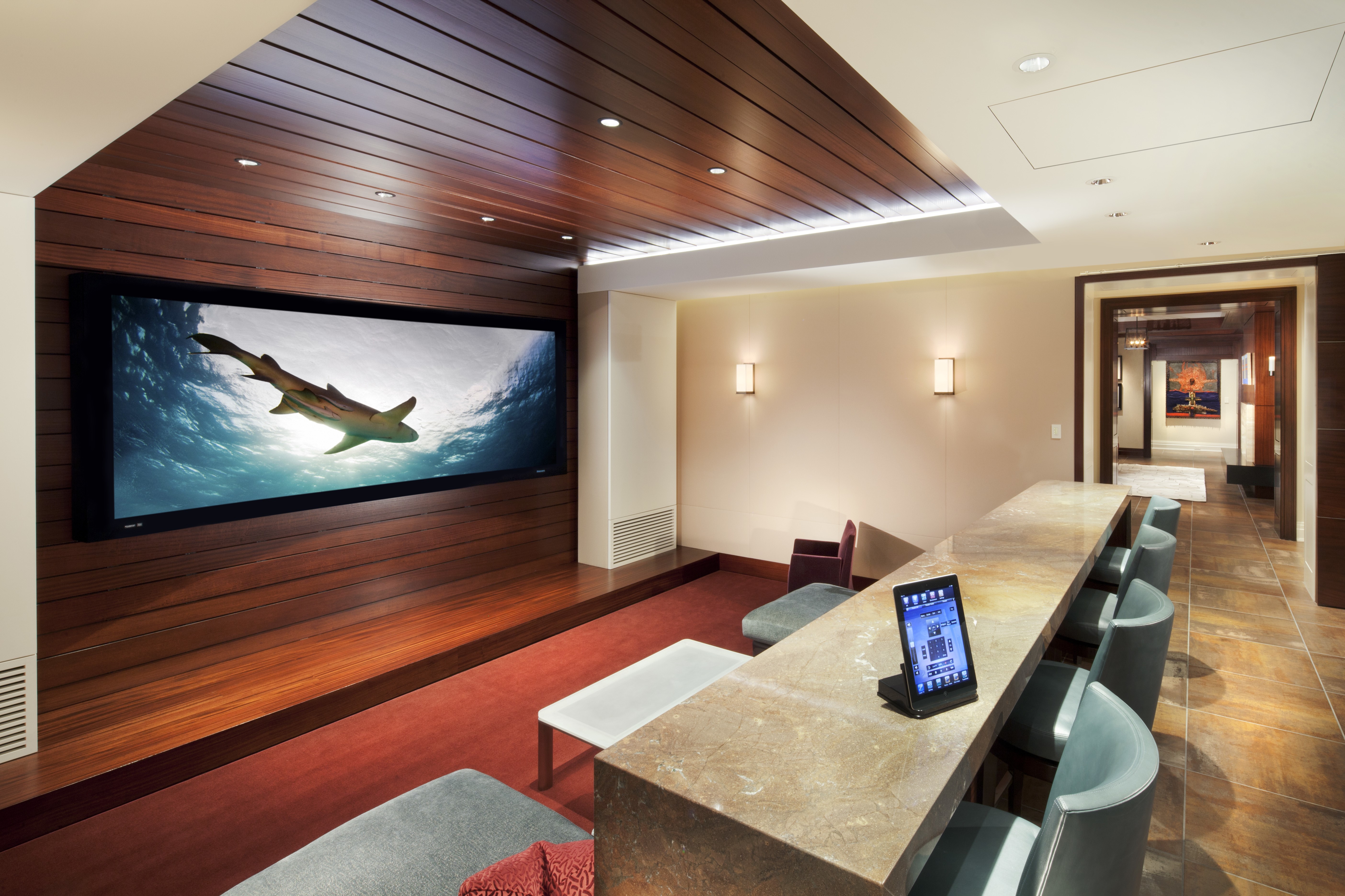 Home theater with large TV and bar seating HD Wallpaper