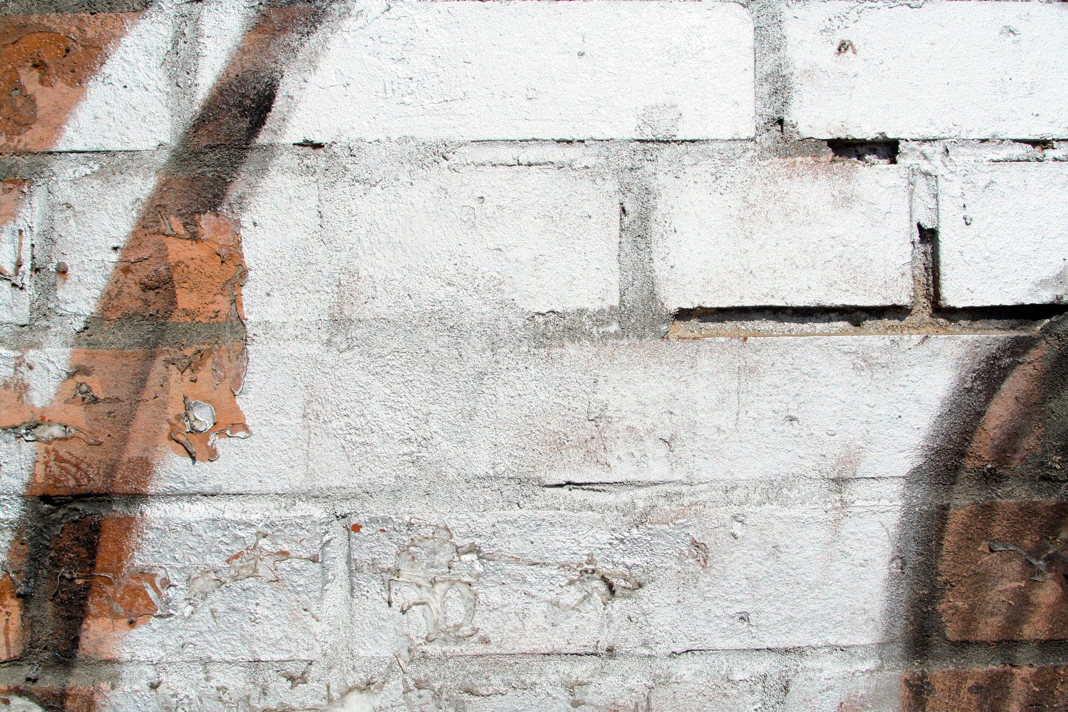 Graffiti on a white brick wall HD Wallpaper
