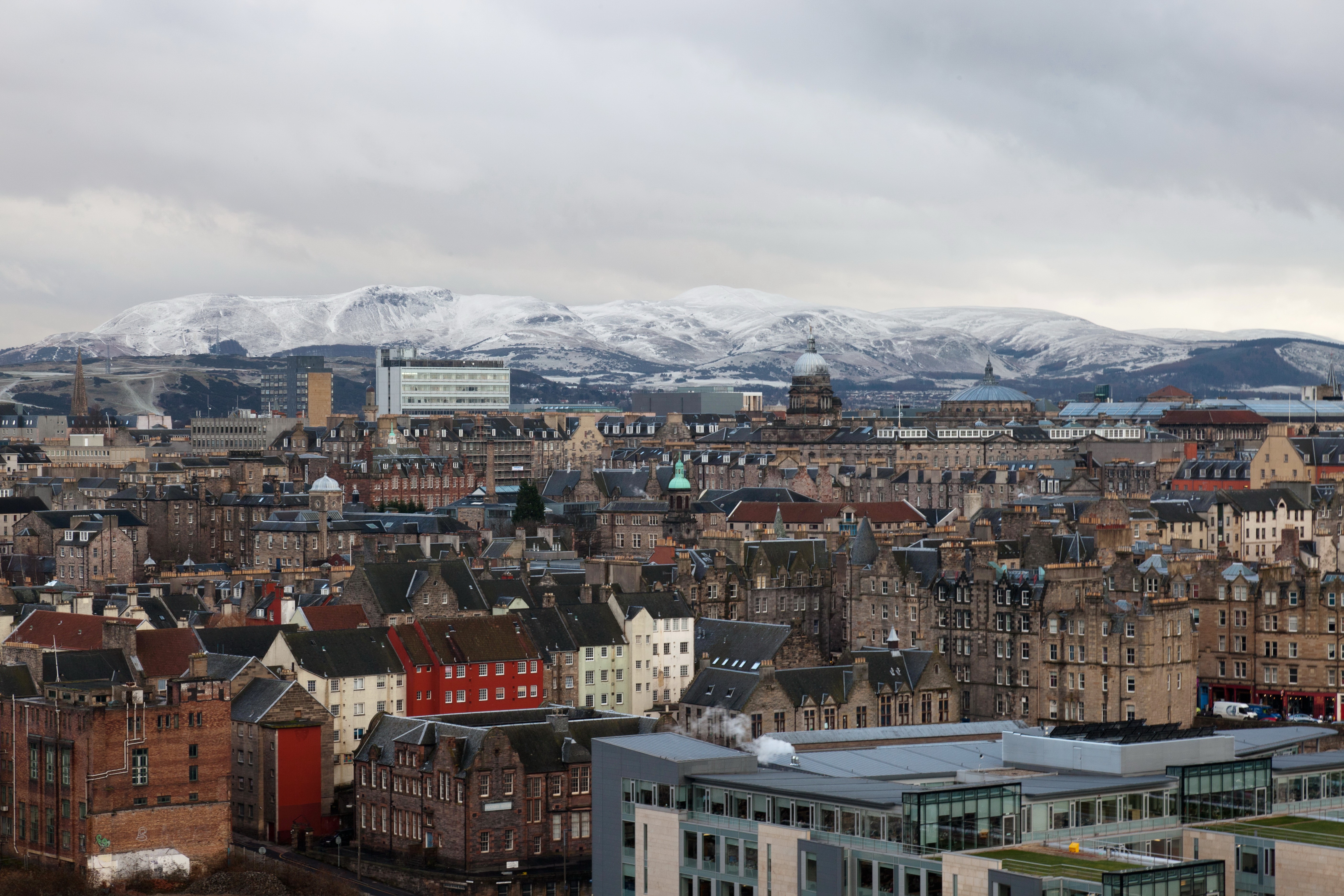 Edinburgh cityscape with snow-capped mountains HD Wallpaper