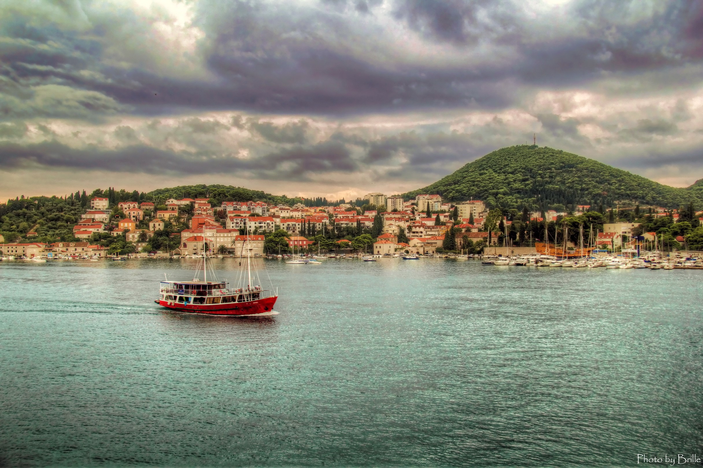 Red riverboat sailing past Dubrovnik, Croatia HD Wallpaper