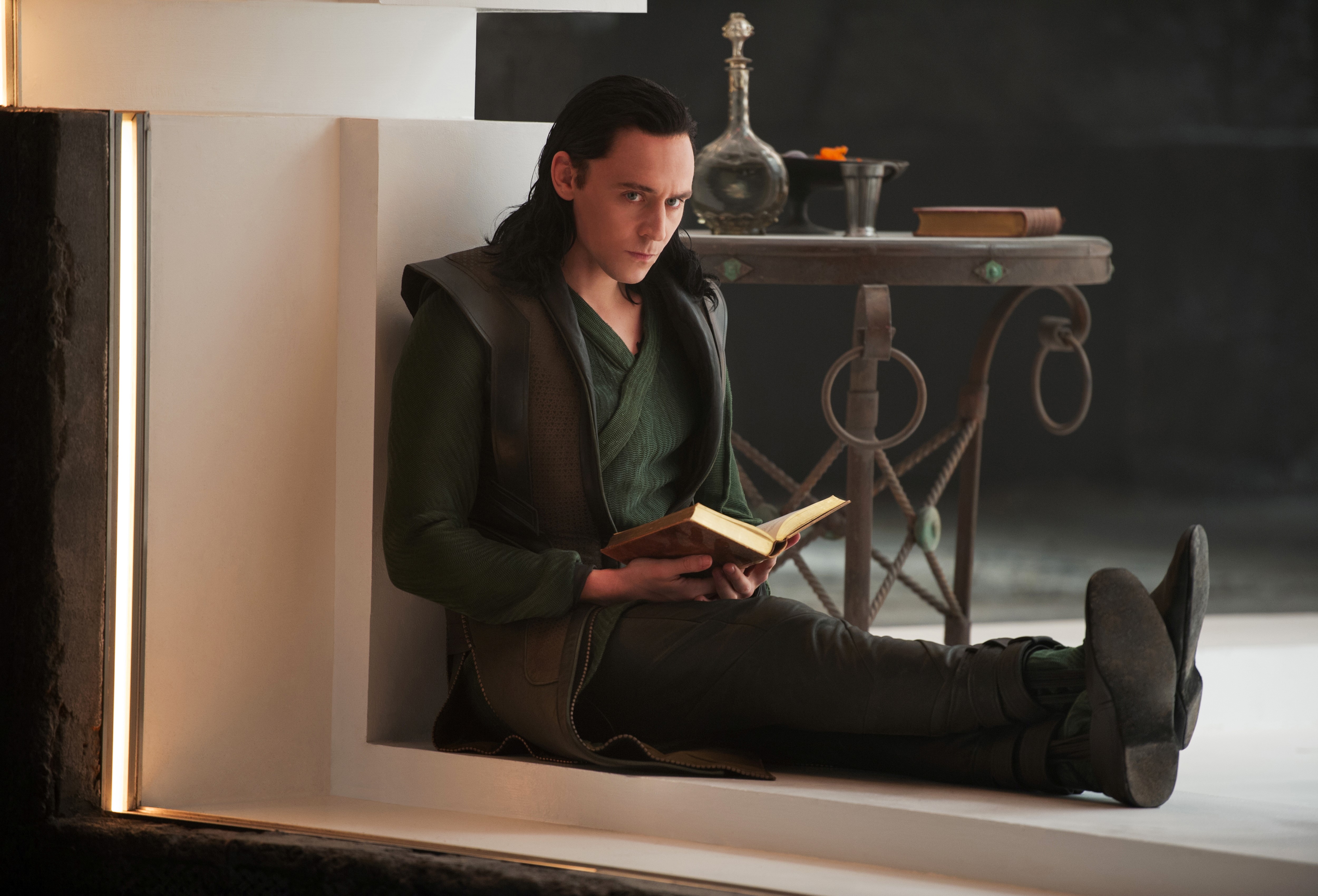 Loki from Thor: The Dark World reading a book HD Wallpaper