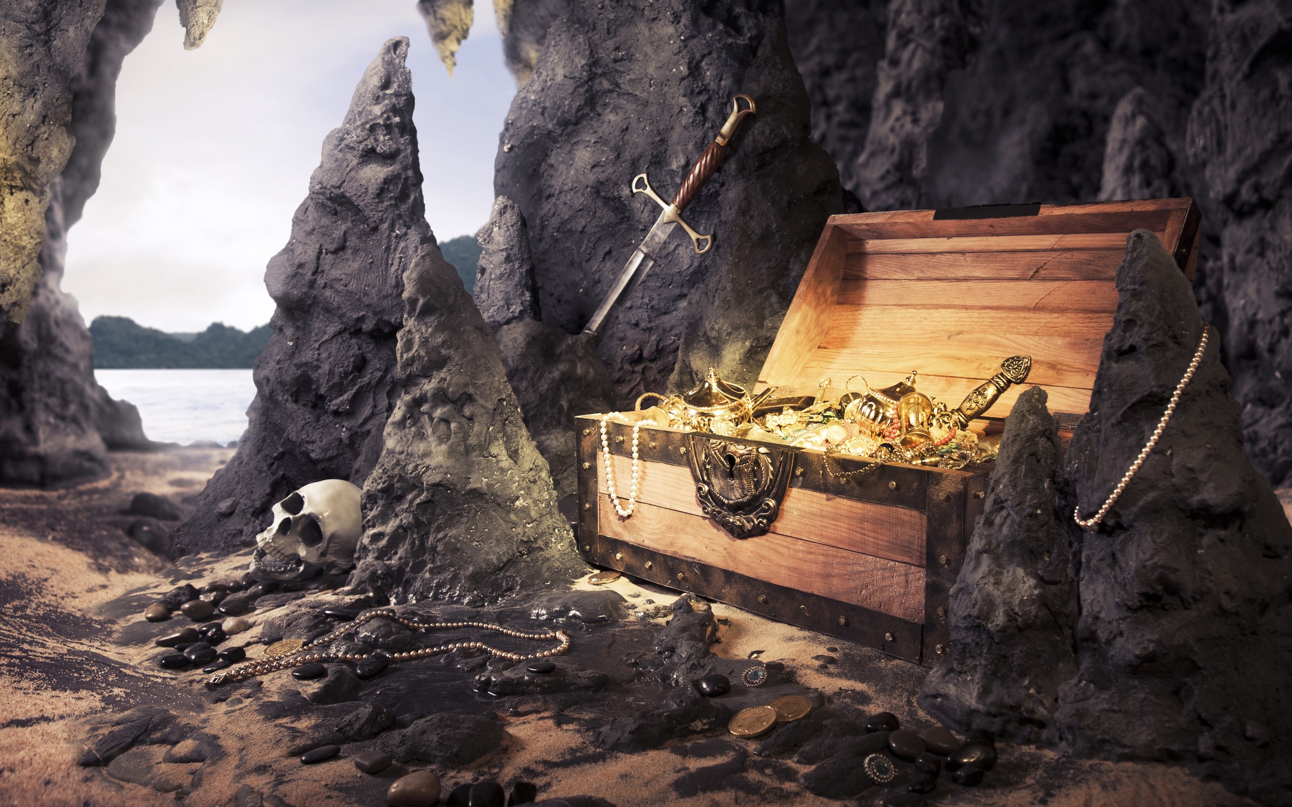 Treasure chest filled with gold and jewels in a cave HD Wallpaper