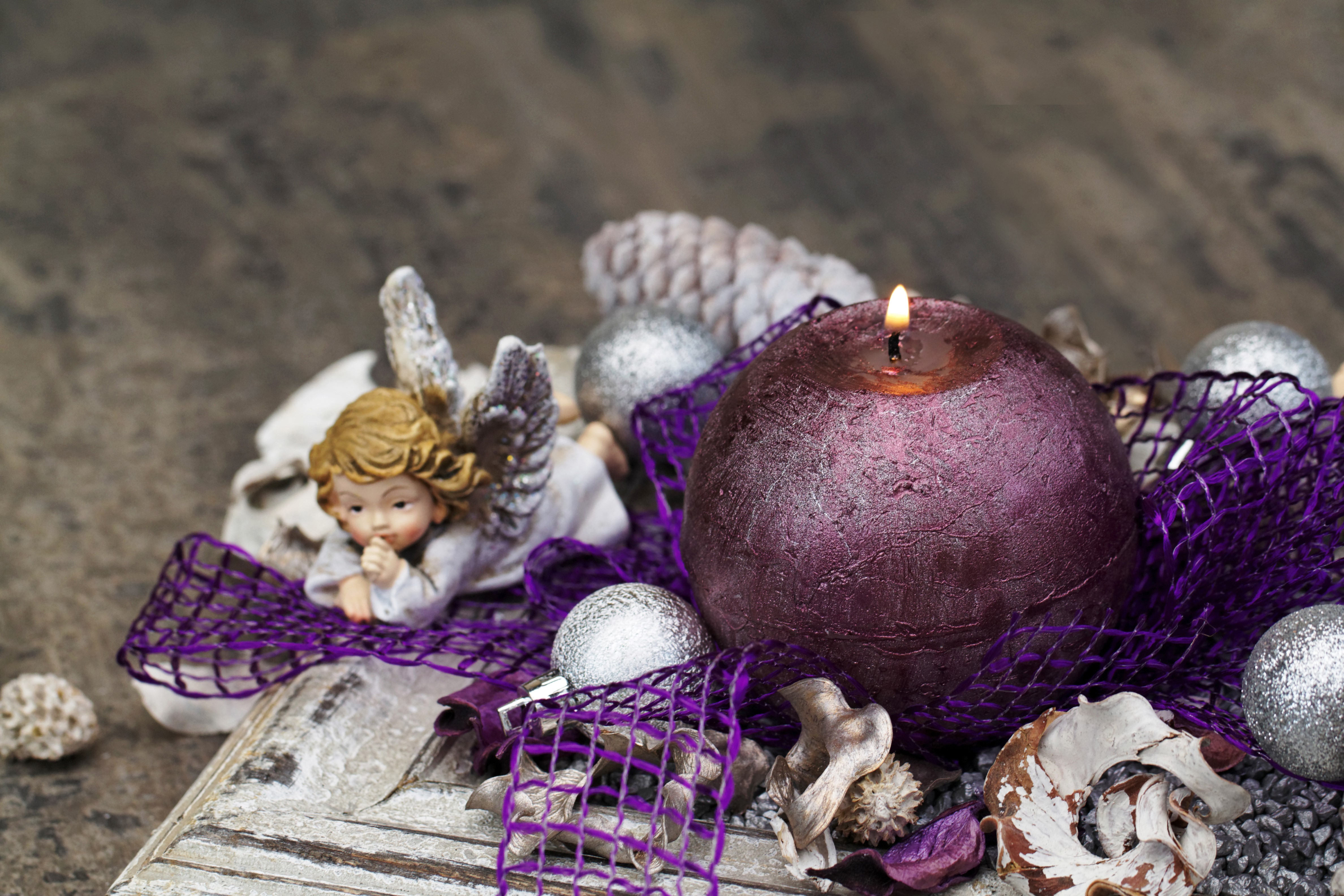 Christmas candle with angel figurine and ornaments HD Wallpaper
