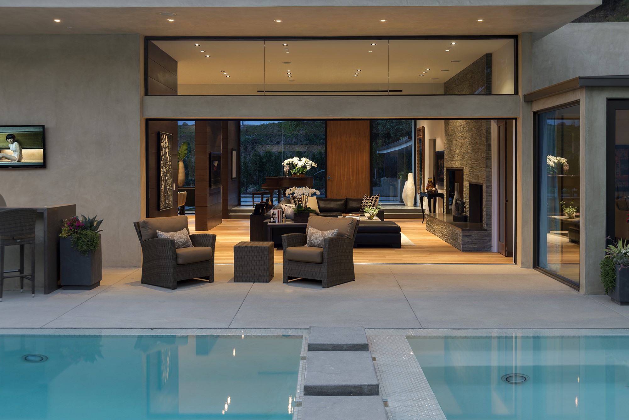 Modern living room with pool and fireplace HD Wallpaper