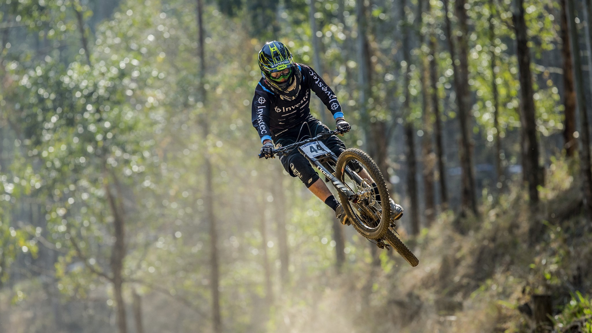 Mountain biker in mid-air jump HD Wallpaper