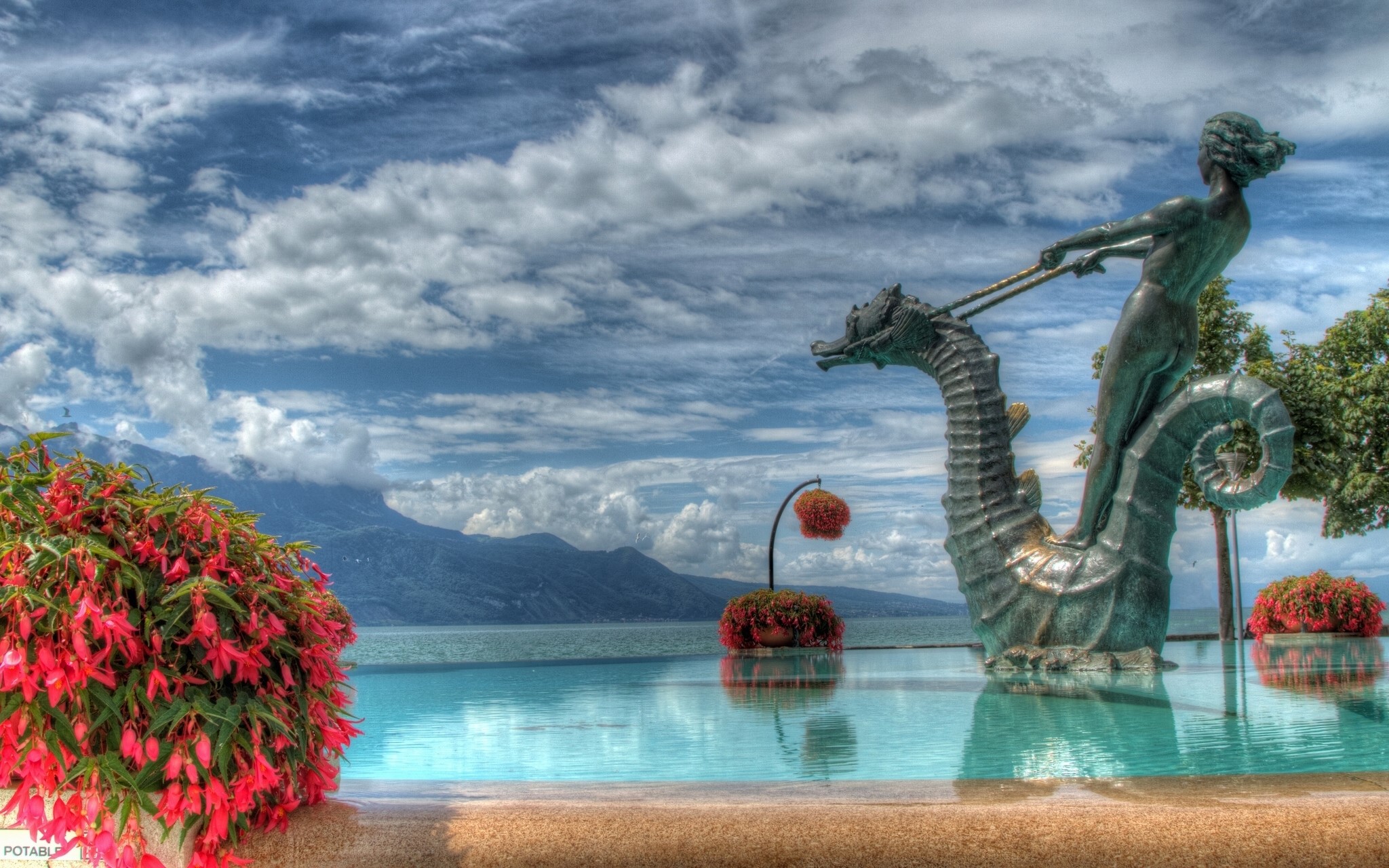 Statue of a woman riding a seahorse in Geneva, Switzerland HD Wallpaper