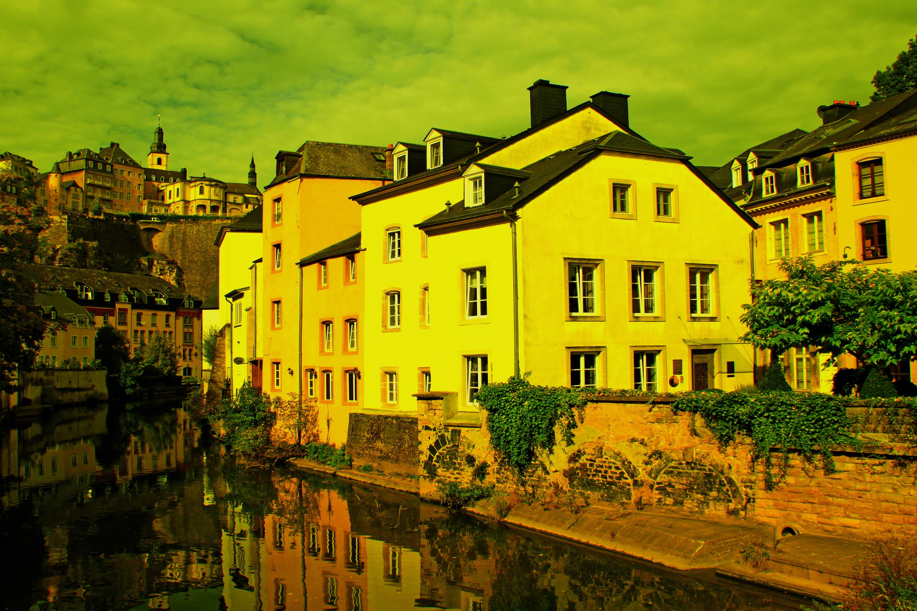 Yellow houses along a canal in Luxembourg HD Wallpaper