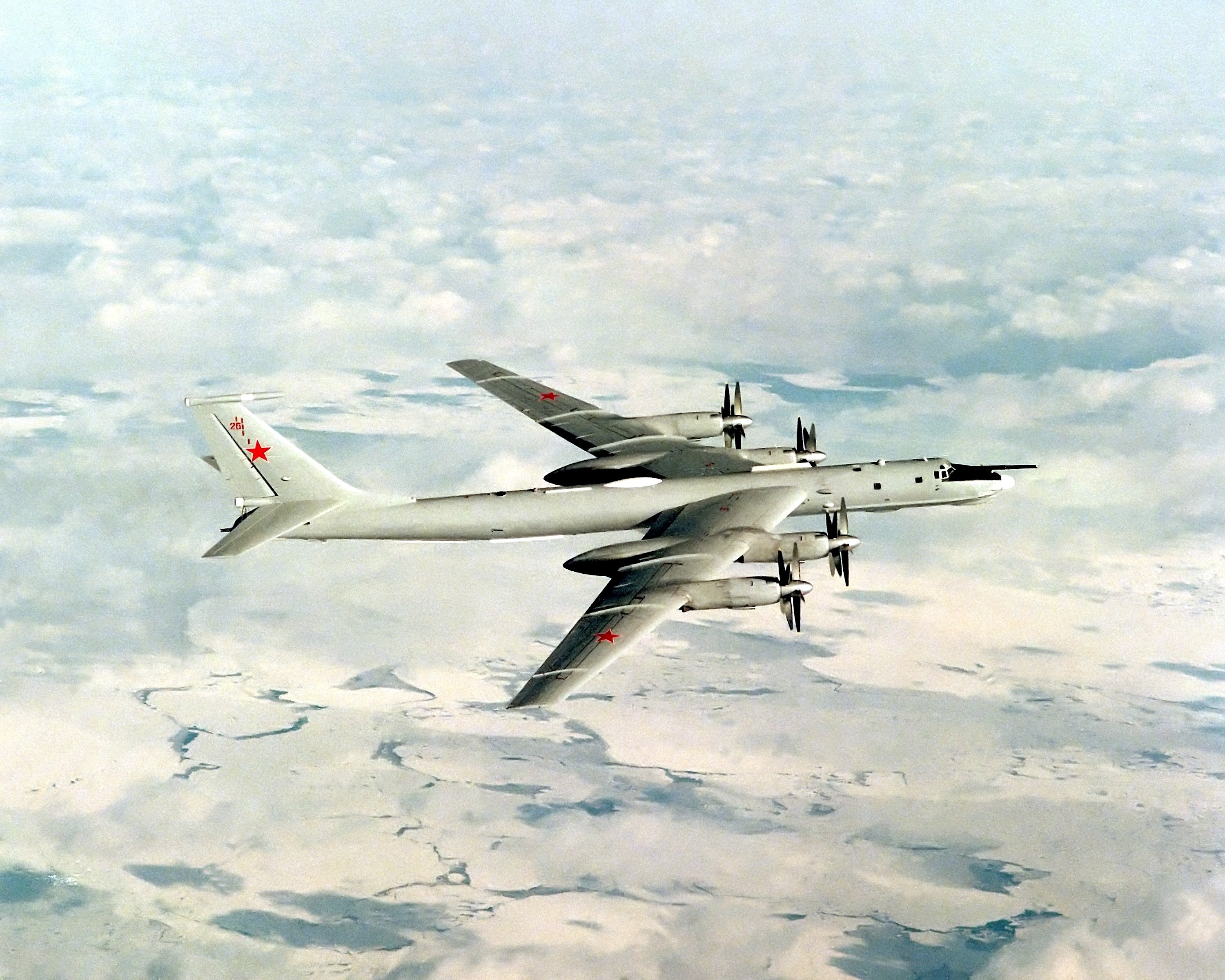 Tu-95 bomber flying over clouds HD Wallpaper