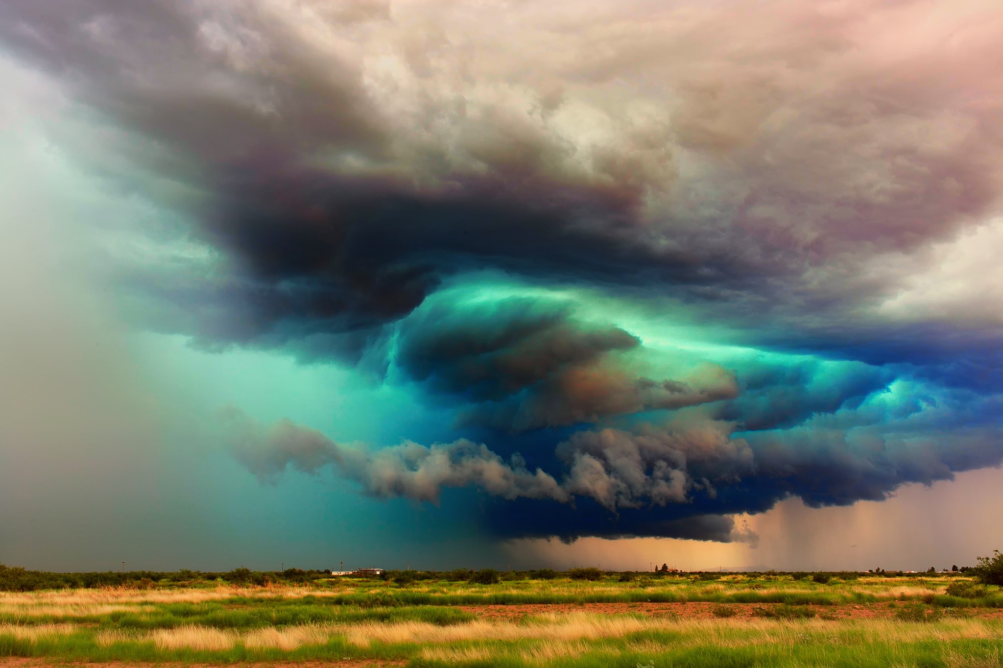 Dramatic storm clouds over a grassy plain in Arizona HD Wallpaper