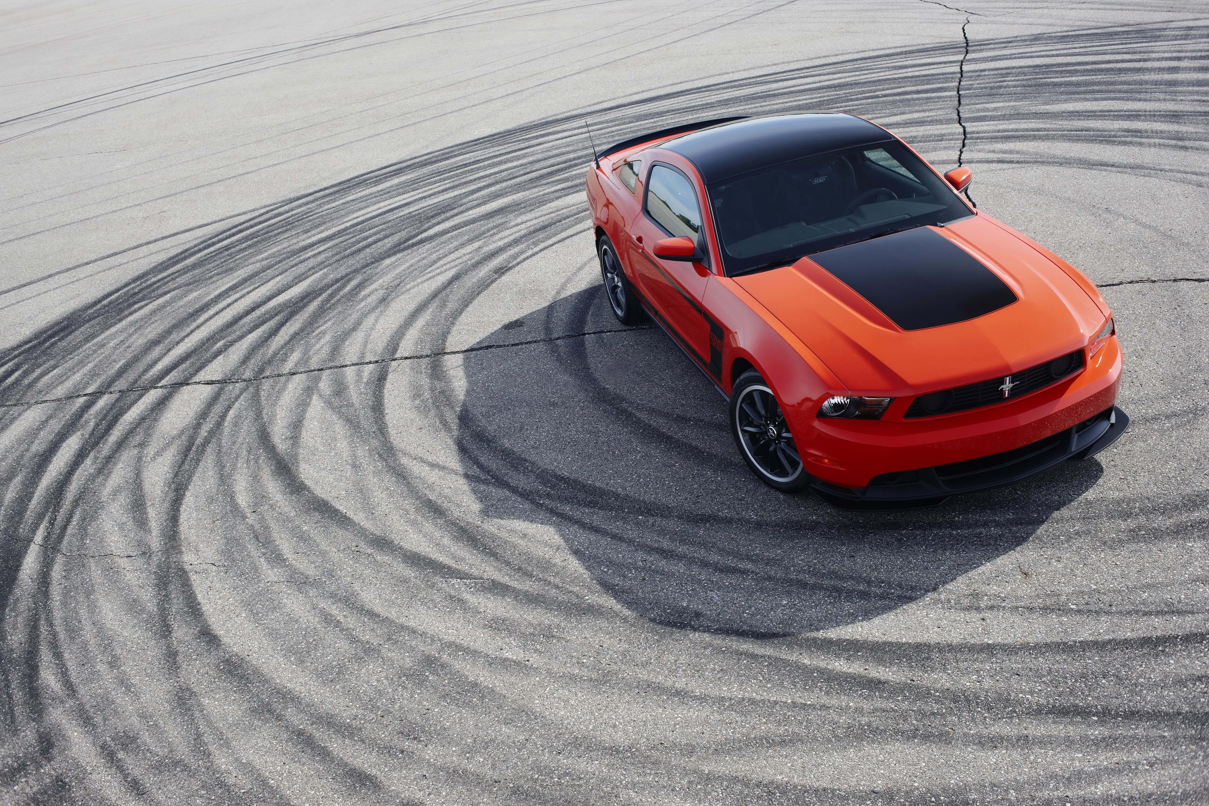 2012 Ford Mustang Boss 302 on asphalt with tire marks HD Wallpaper