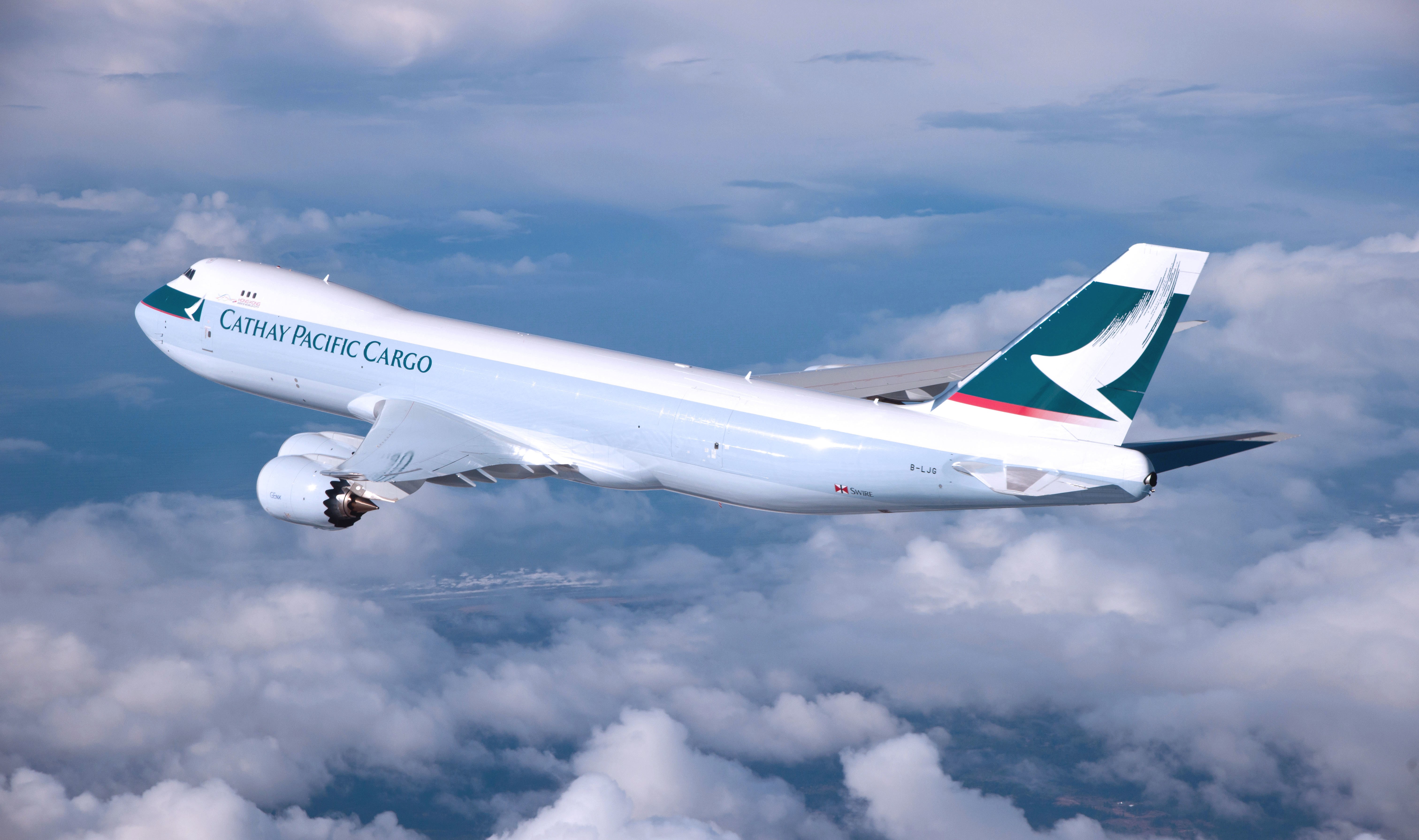 Cathay Pacific Cargo Boeing 747 flying through clouds HD Wallpaper