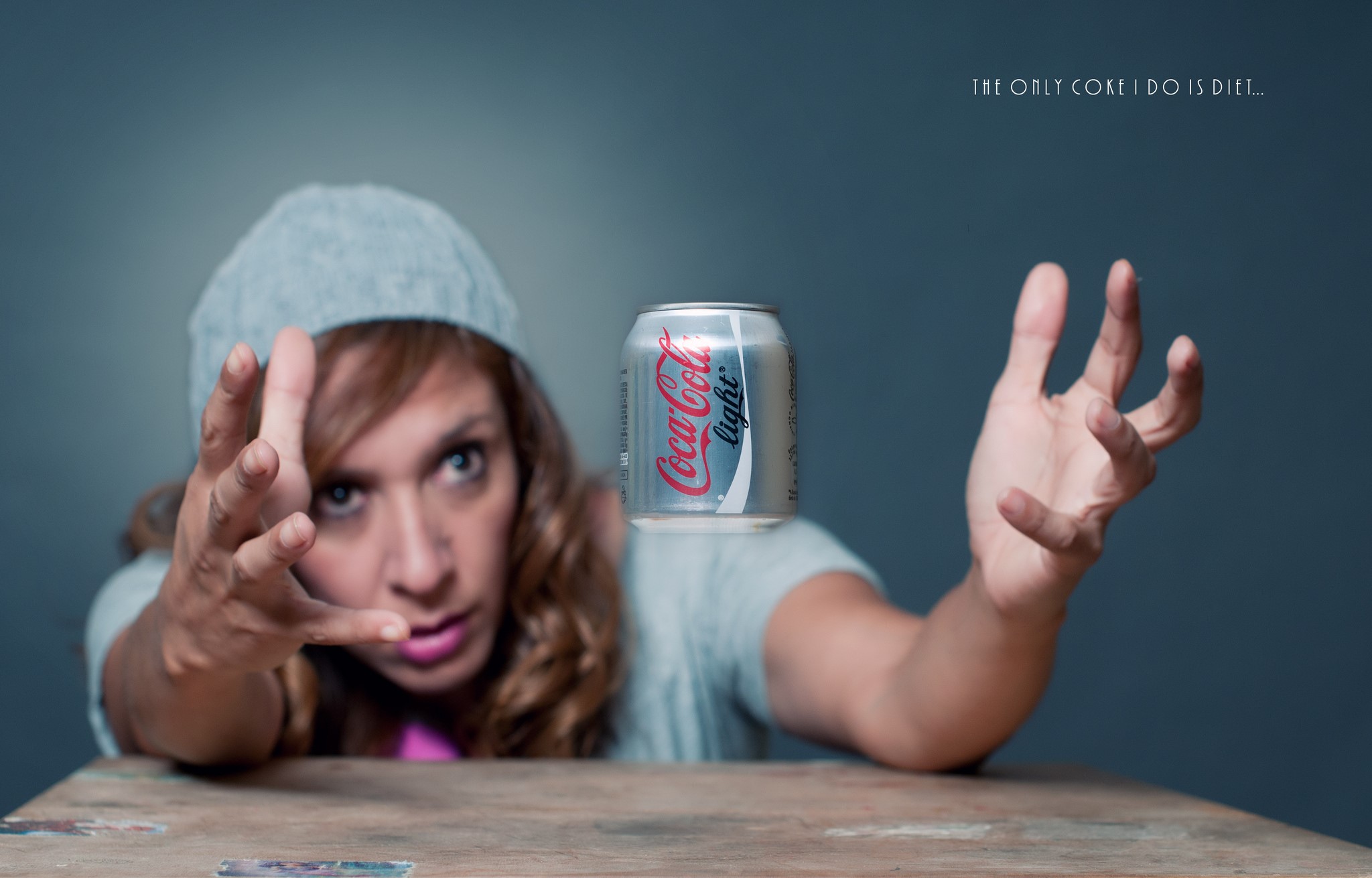 Woman reaching for Coca-Cola Light can HD Wallpaper