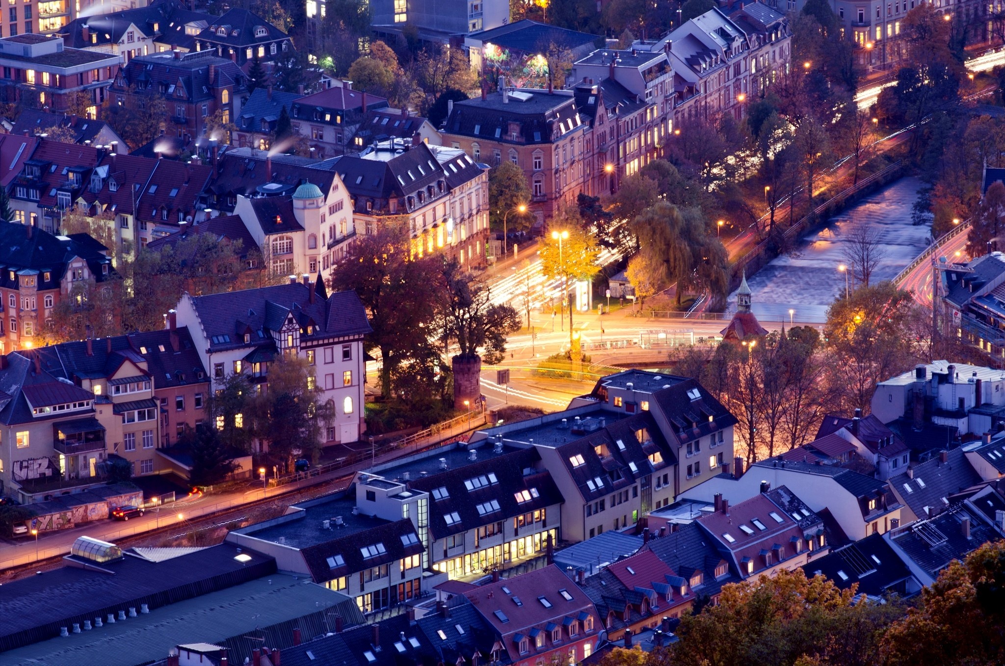 Aerial view of German city at night with river and lights HD Wallpaper