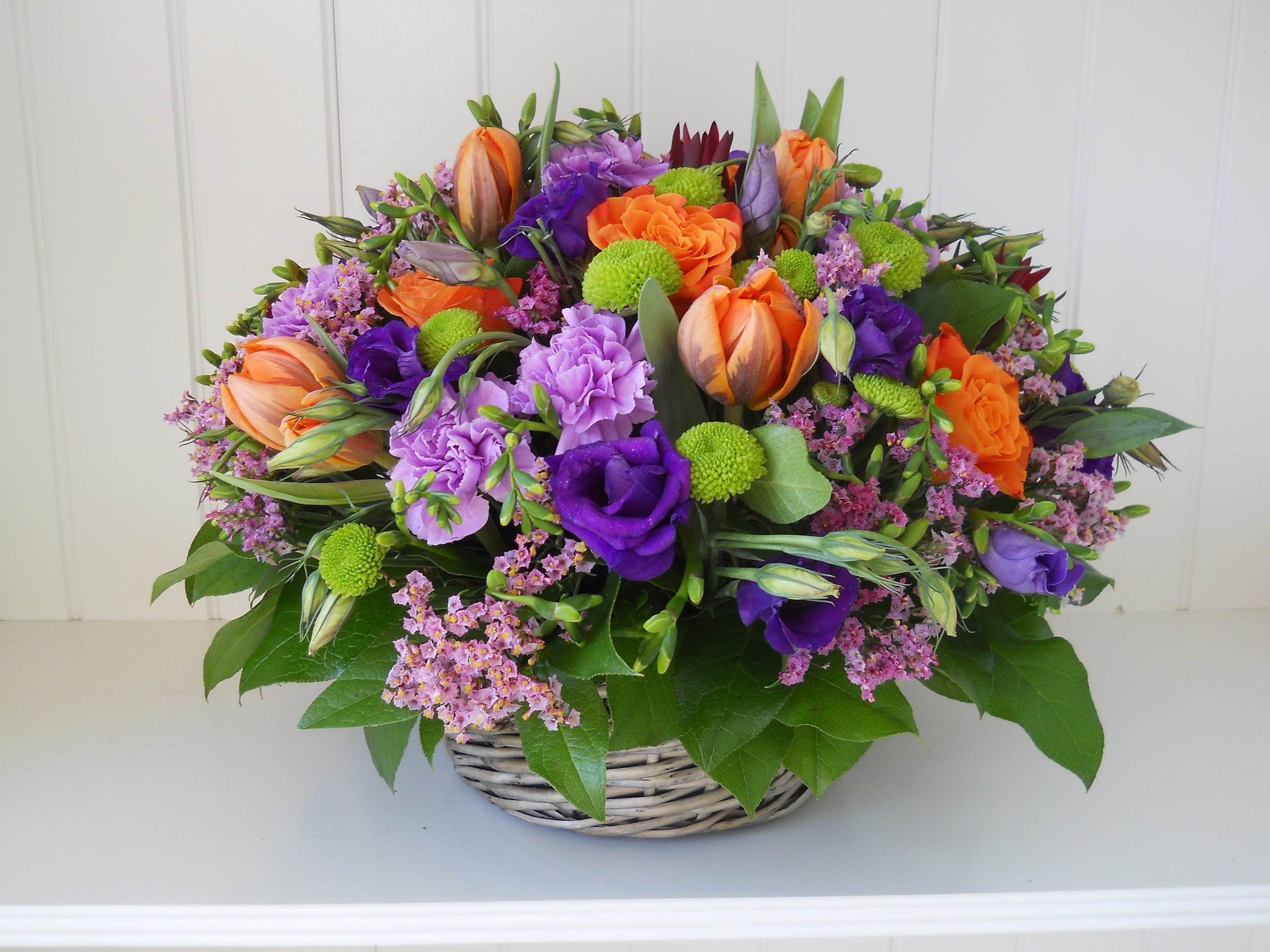 Colorful flower arrangement in a basket HD Wallpaper