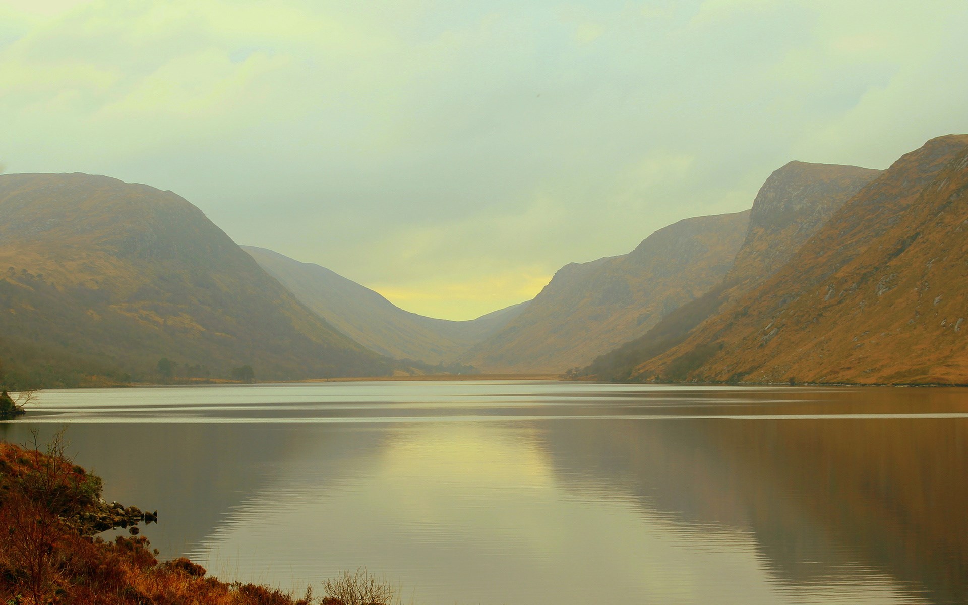 Lake and mountains under a cloudy sky HD Wallpaper