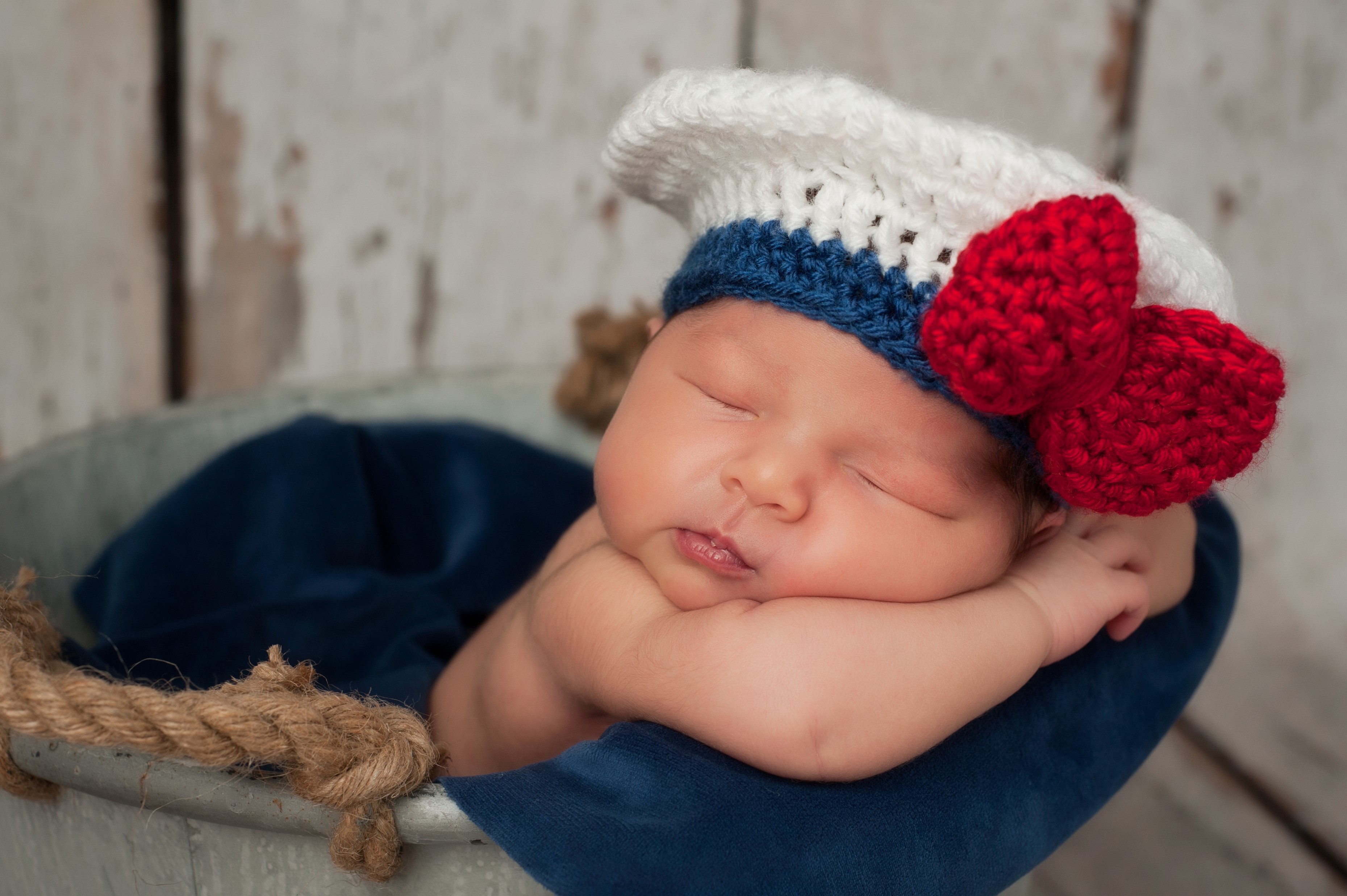 Newborn baby wearing a sailor hat HD Wallpaper
