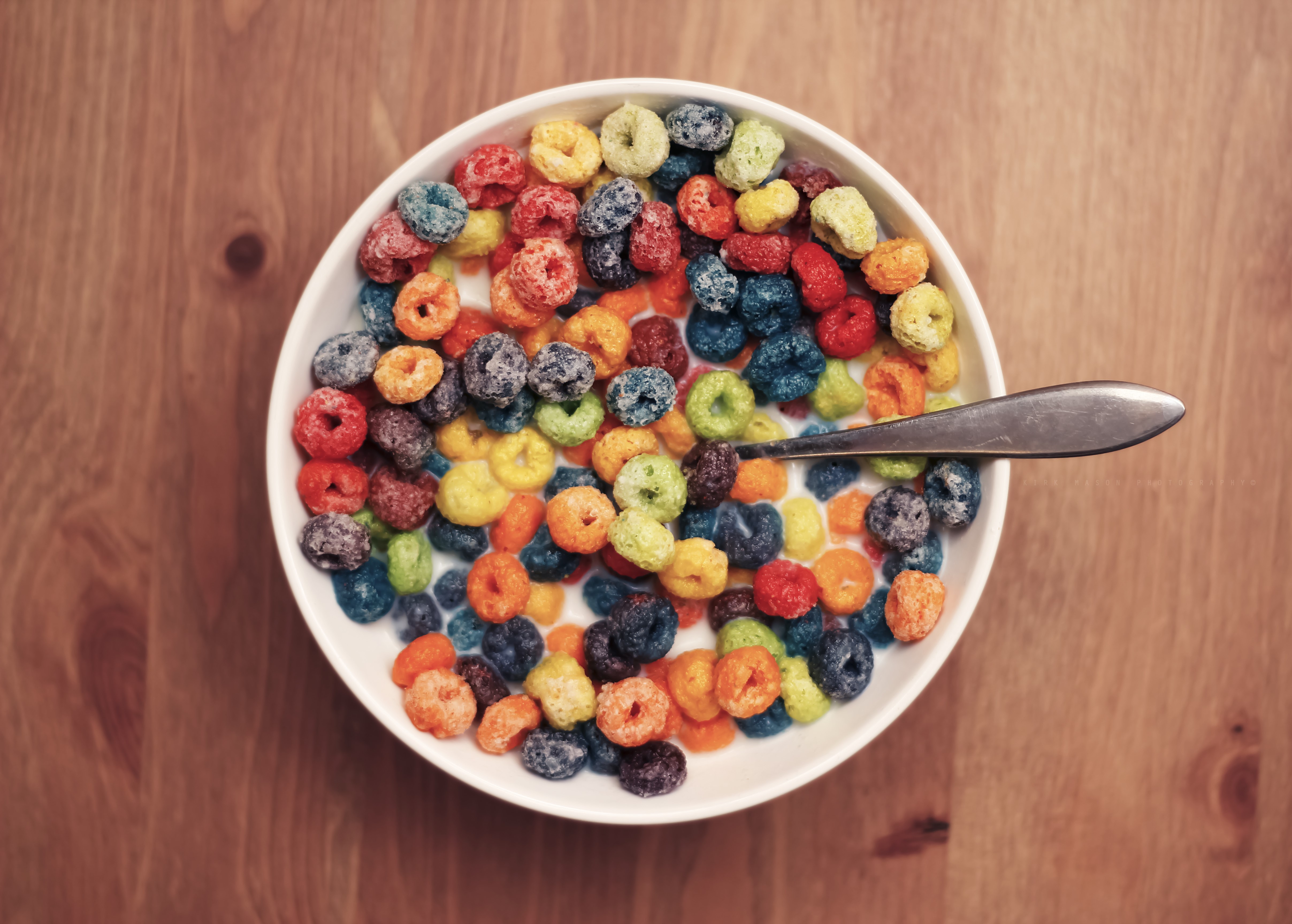 Bowl of colorful cereal with spoon HD Wallpaper