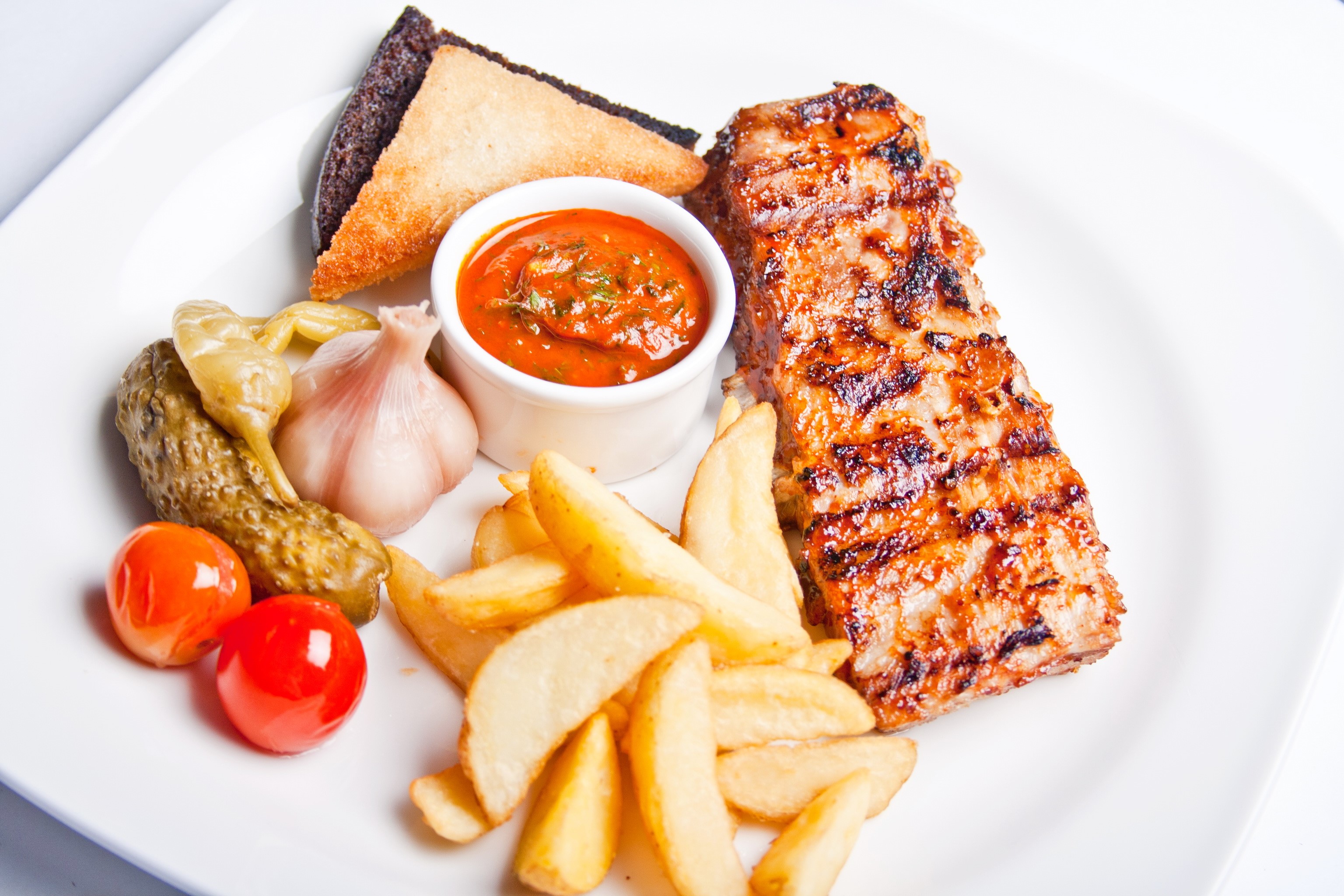 Grilled meat with fries and pickles HD Wallpaper