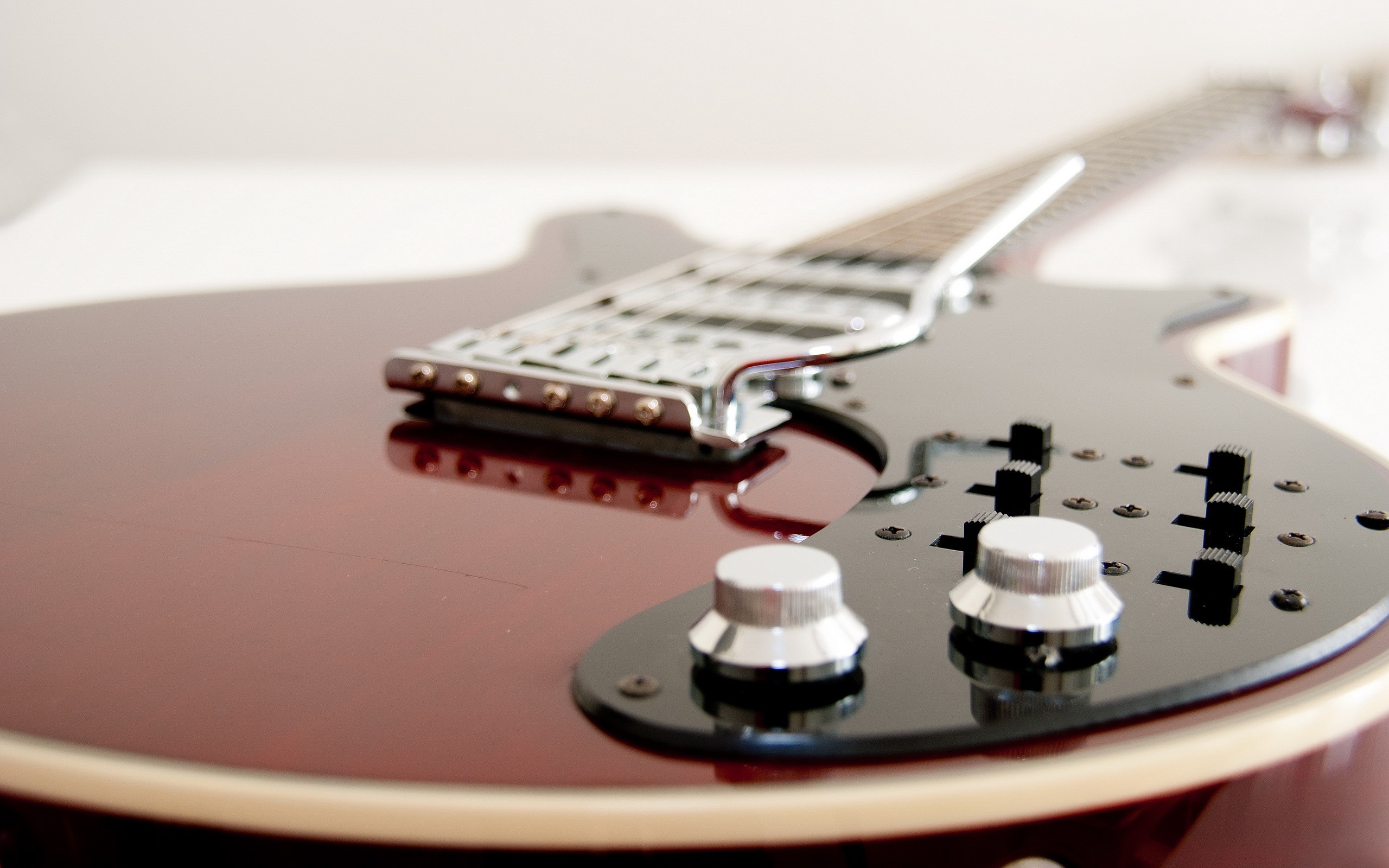 Close-up of a red electric guitar HD Wallpaper
