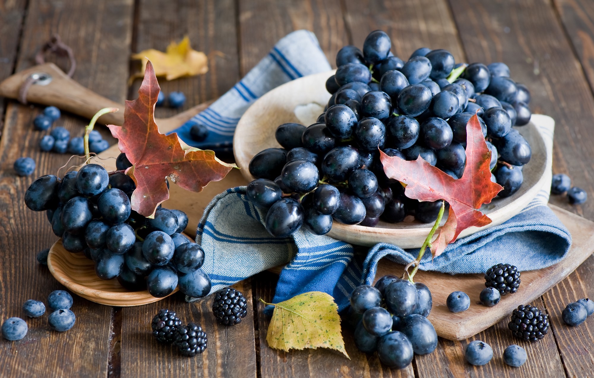 Grapes and berries on a wooden table HD Wallpaper