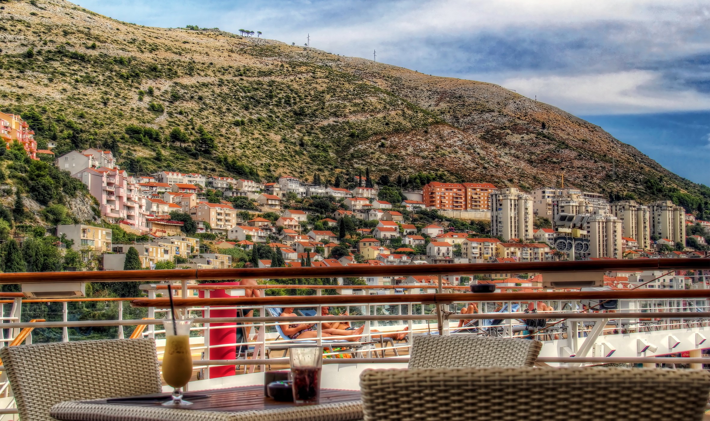 View of Dubrovnik from a cruise ship deck with drinks HD Wallpaper