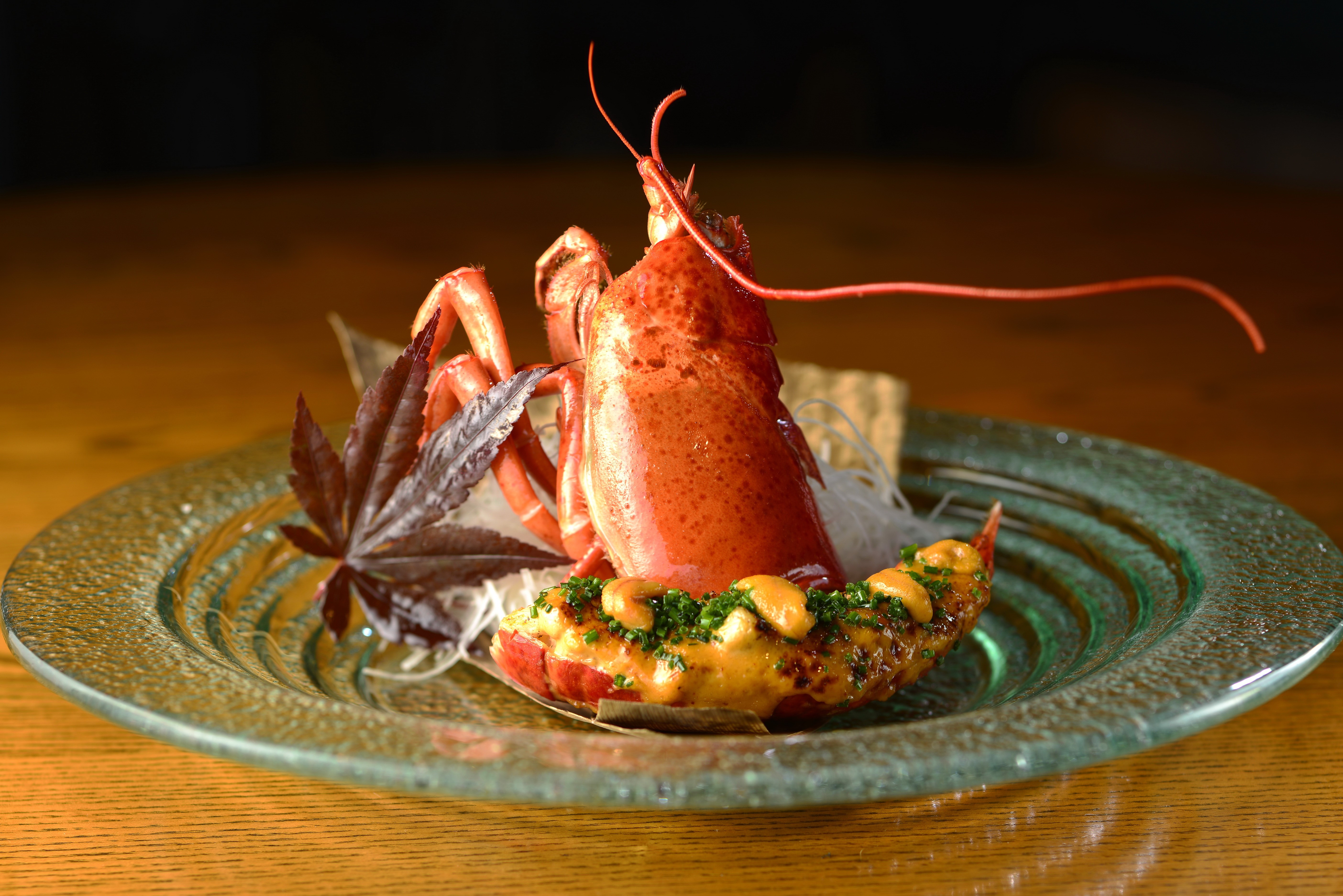 Cooked Lobster Tail with Cashews and Herbs on Plate HD Wallpaper