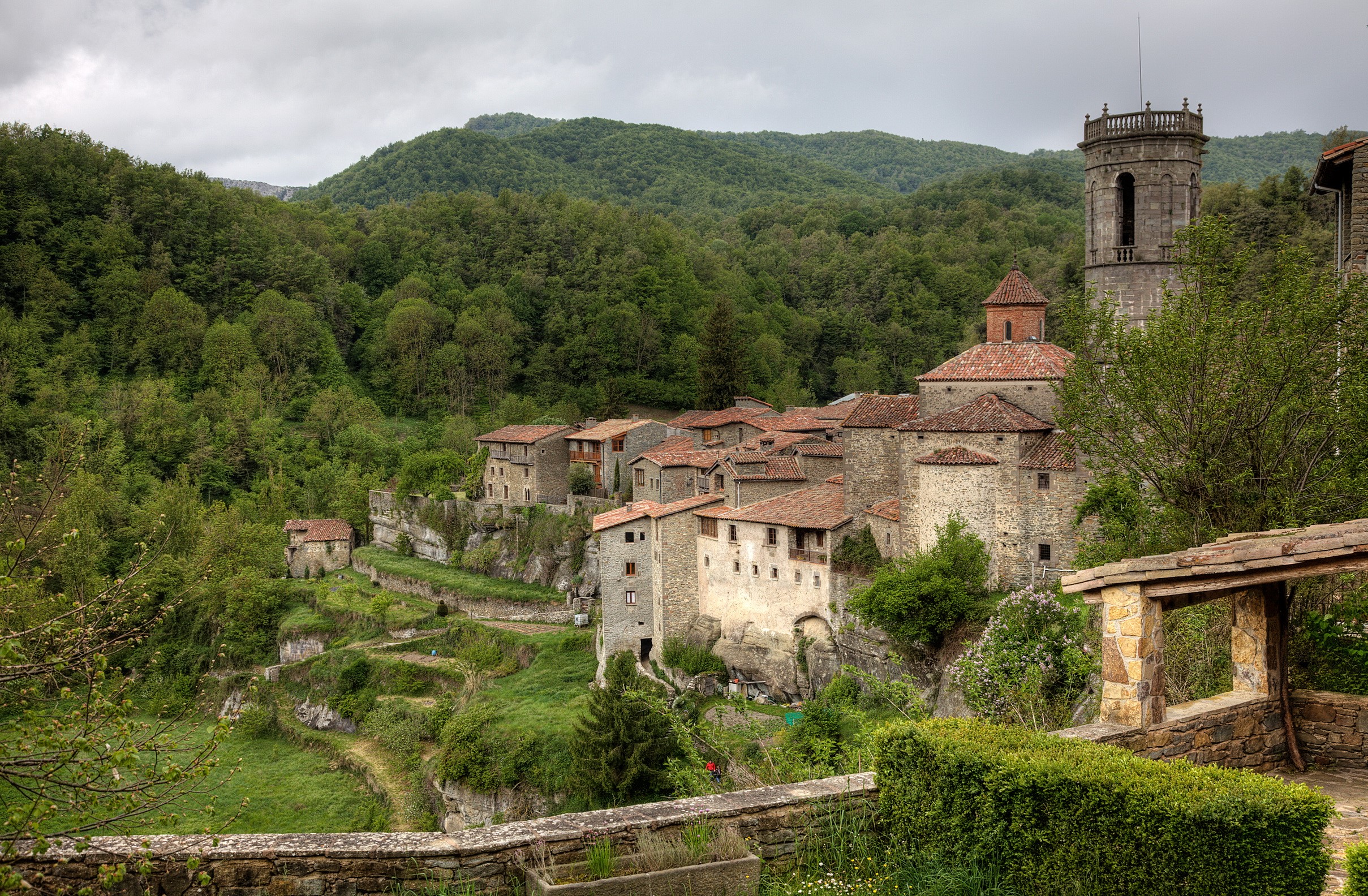 Stone village with a tower in a green forest HD Wallpaper