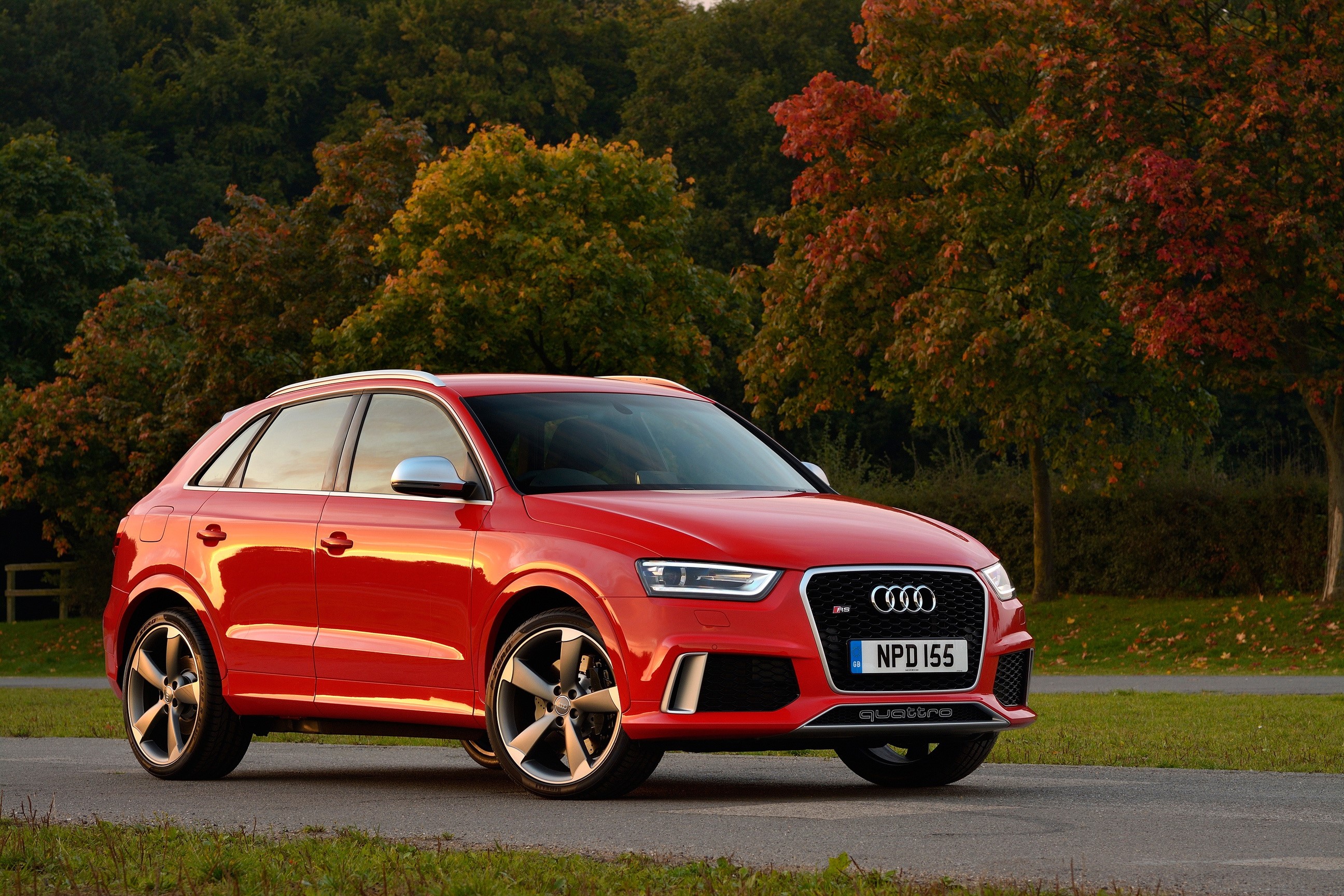 Red Audi RS Q3 parked on a road HD Wallpaper