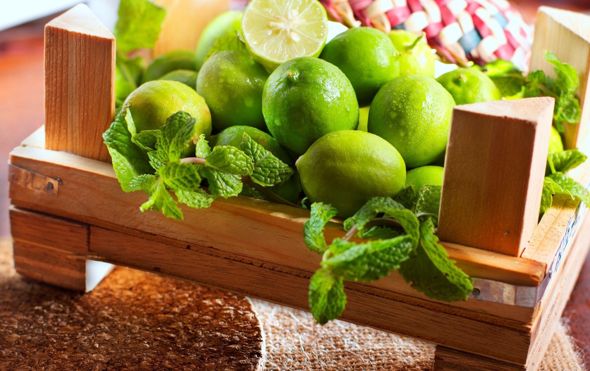 Limes and mint in a wooden crate HD Wallpaper