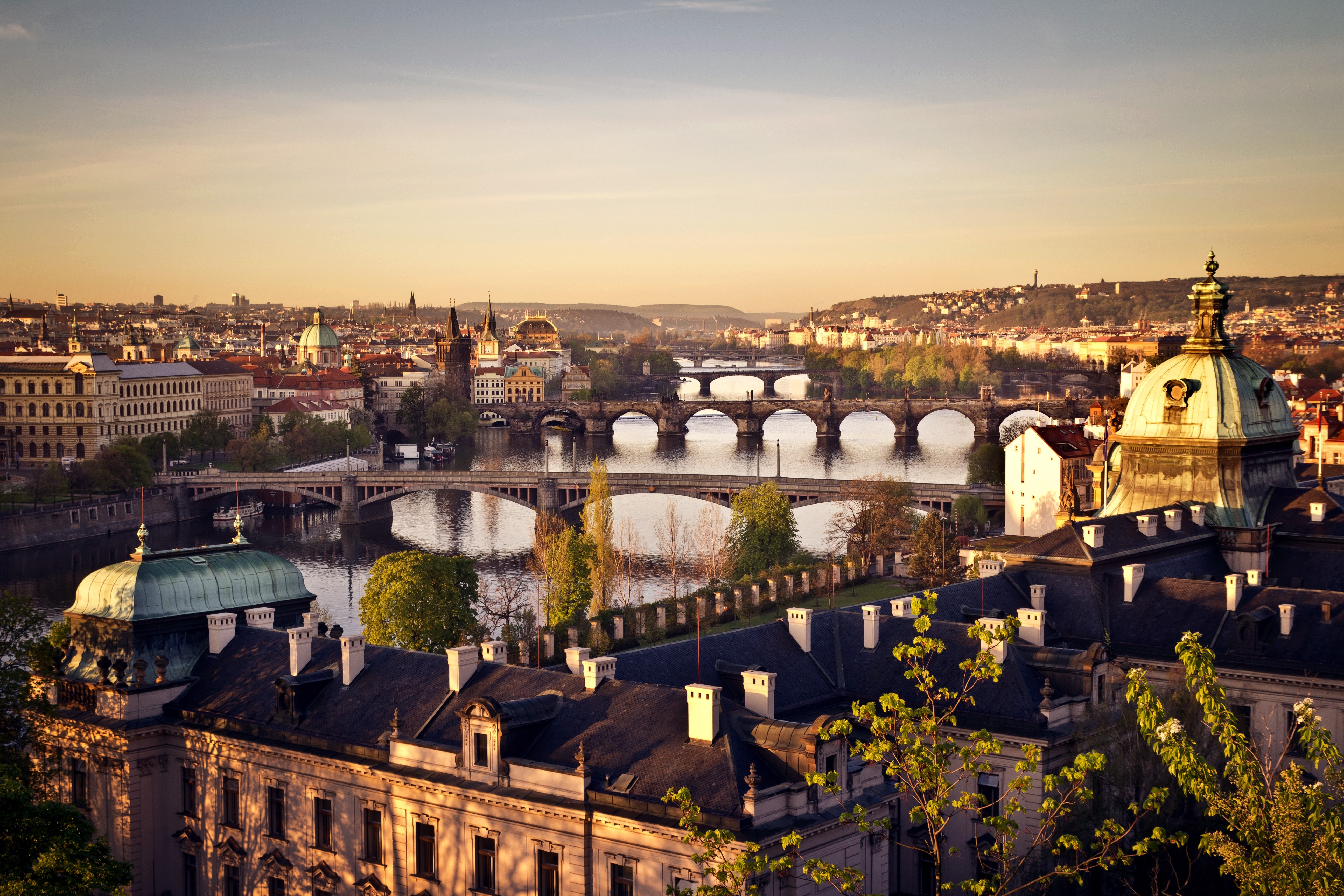 Prague cityscape with bridges over Vltava River at sunset HD Wallpaper
