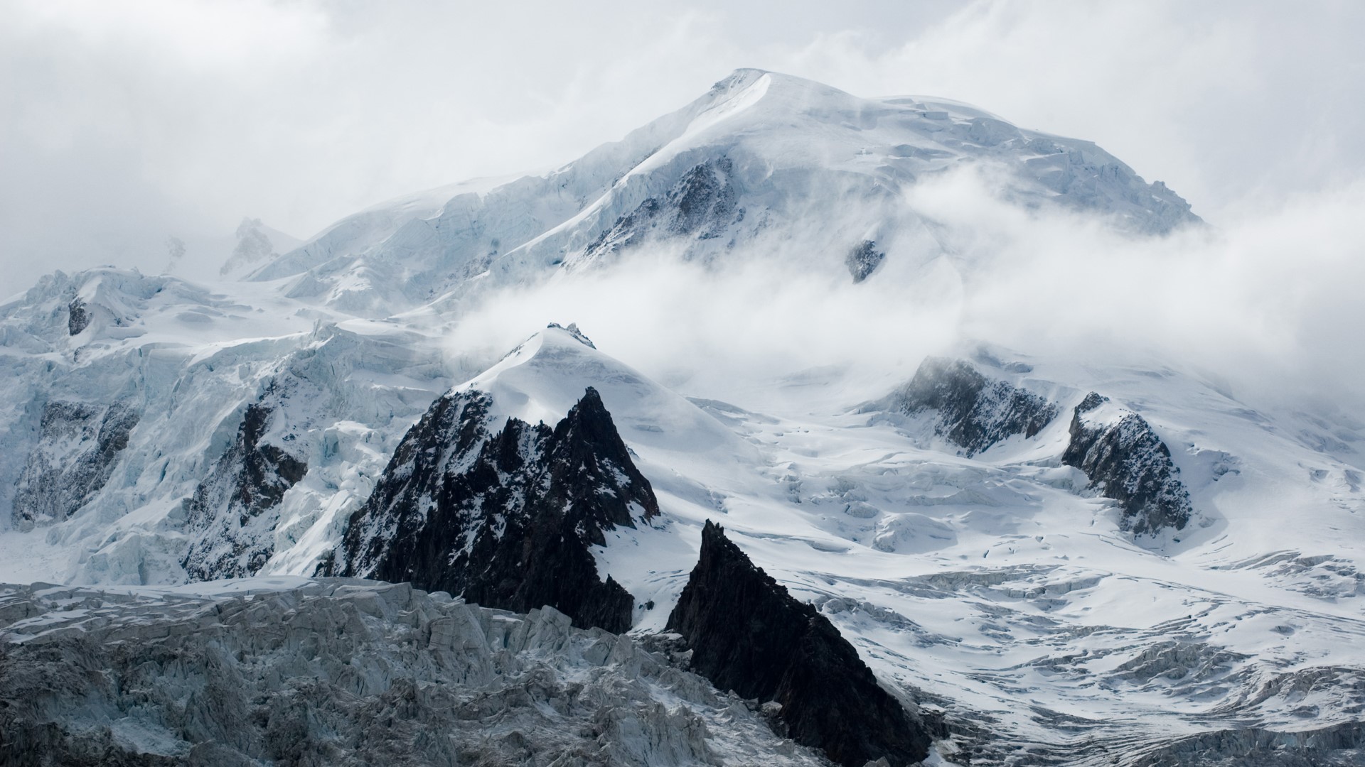 Snow-covered mountains with clouds HD Wallpaper