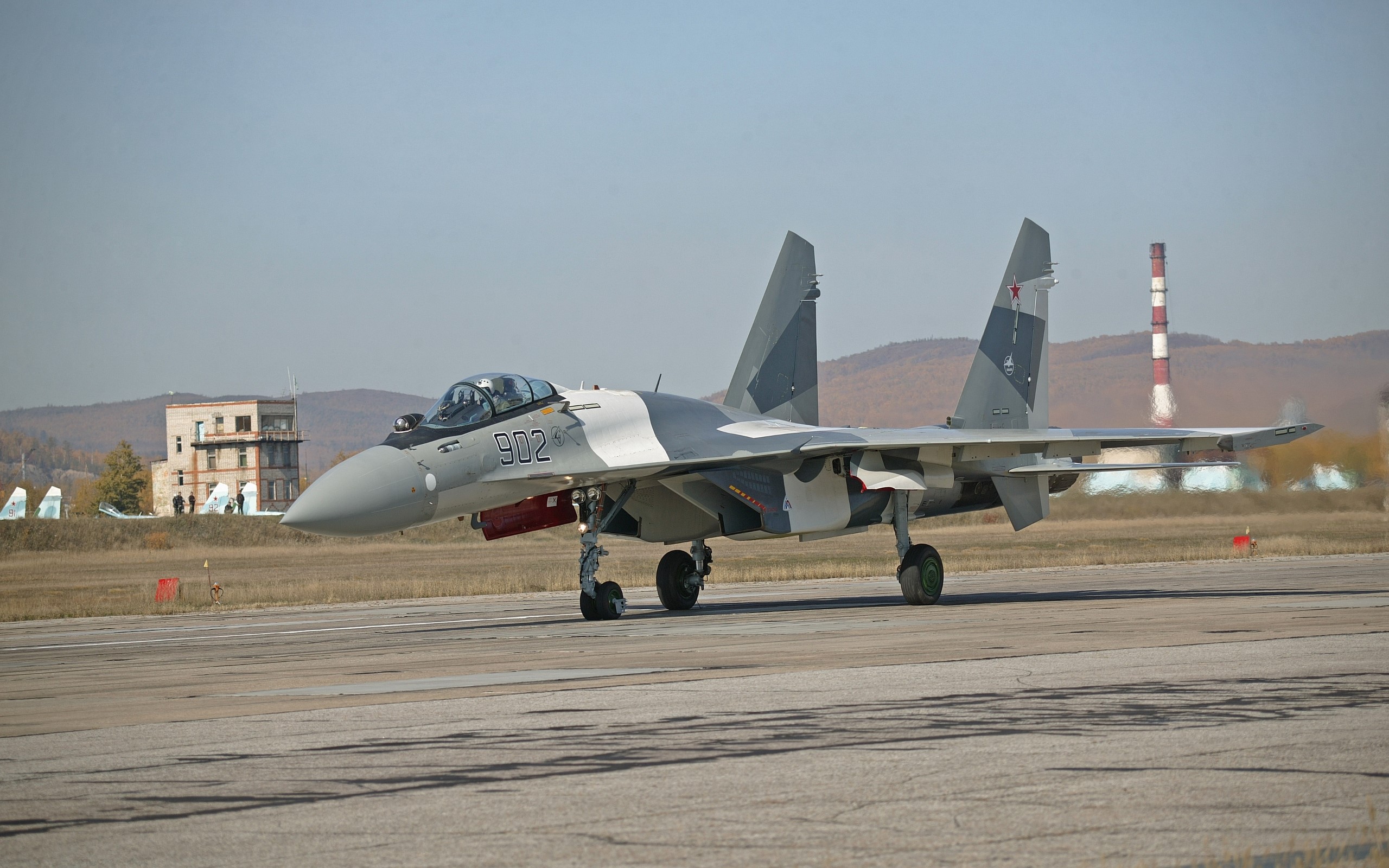 Sukhoi Su-35 fighter jet on a runway HD Wallpaper