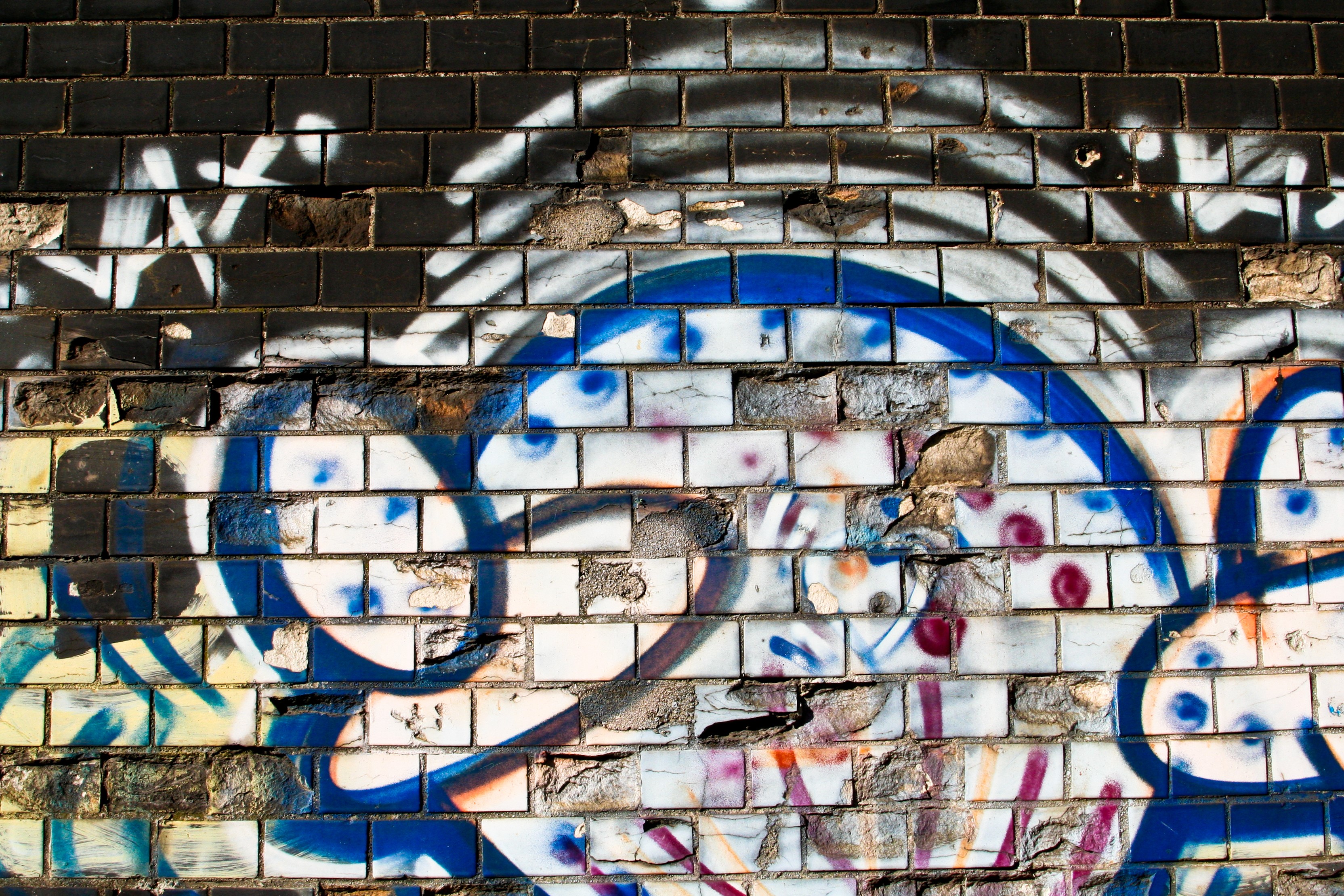 Graffiti on a brick wall HD Wallpaper