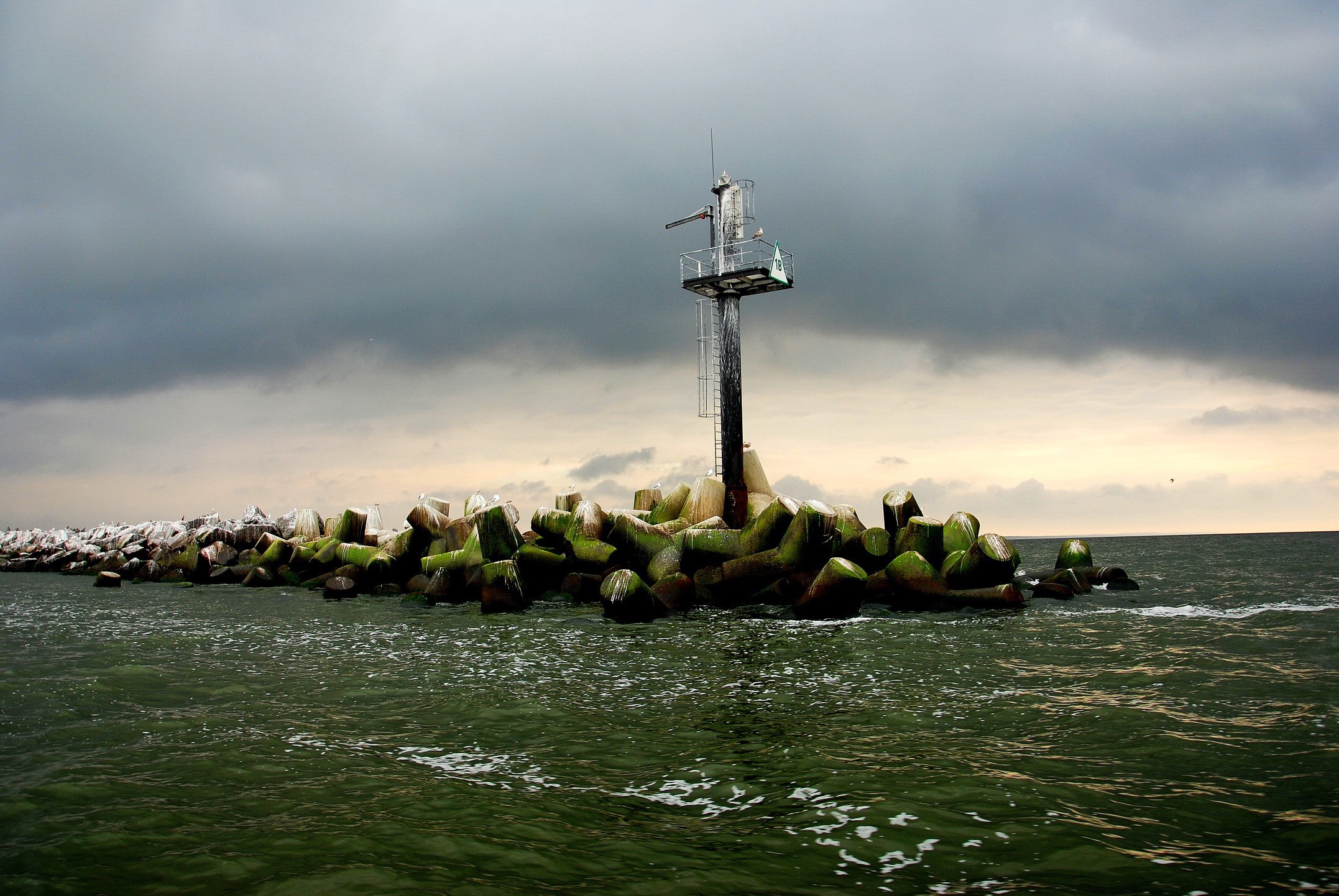 Lighthouse on a breakwater in Lithuania HD Wallpaper