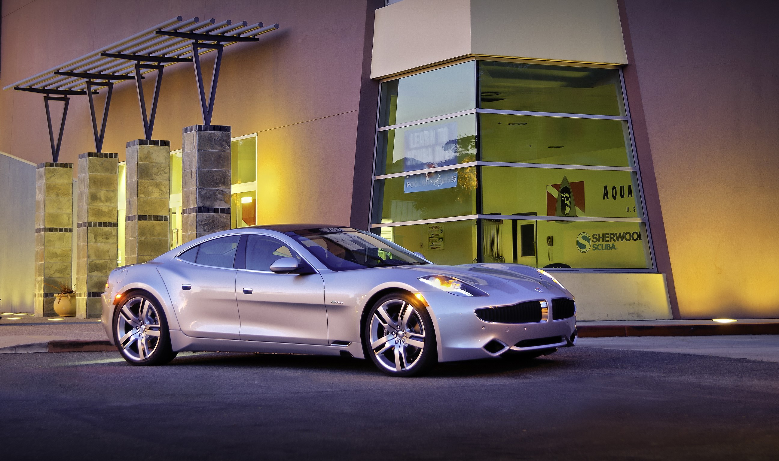 2011 Fisker Karma EVer parked outside building HD Wallpaper