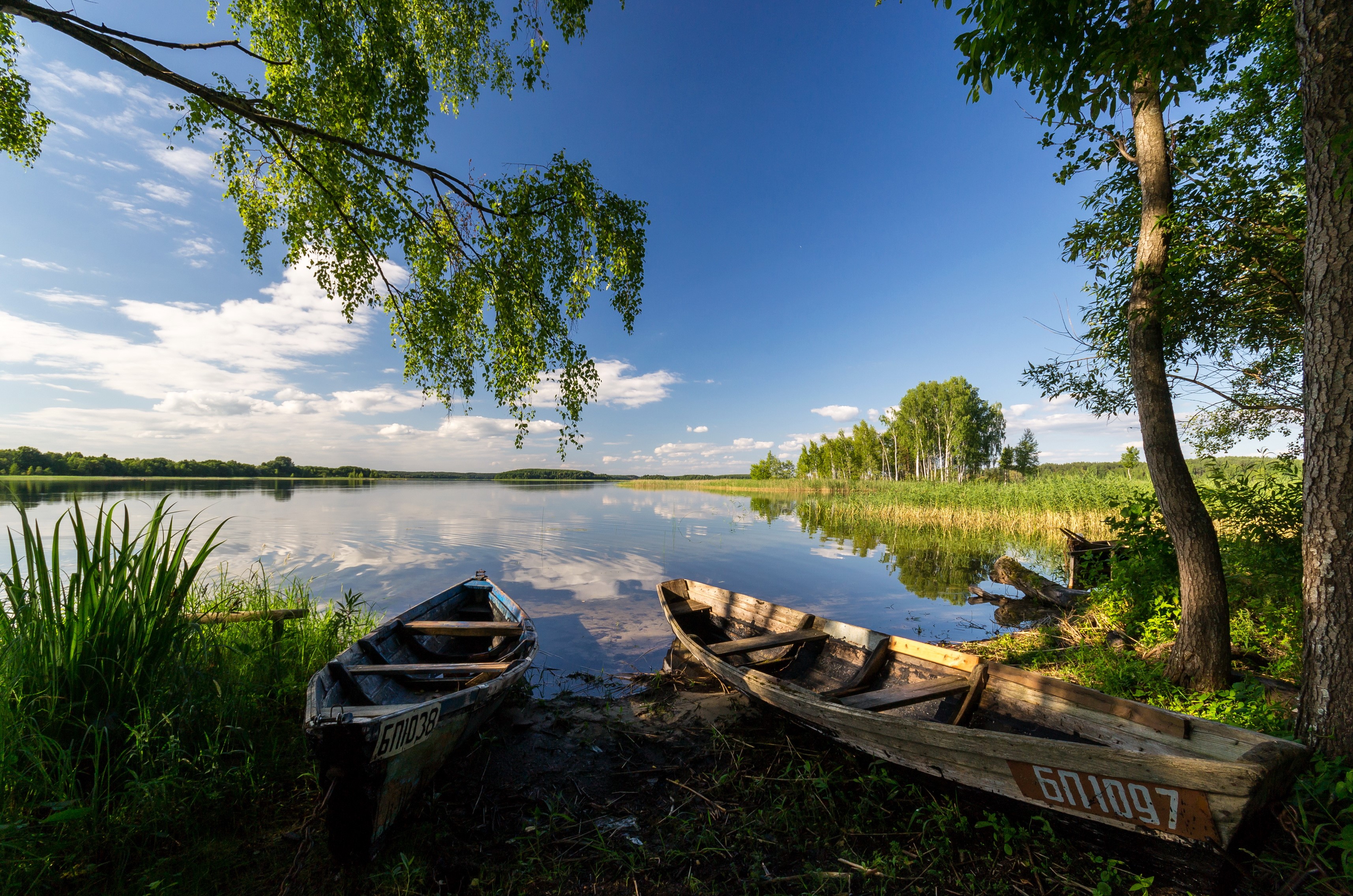 Two wooden boats on the shore of a lake in Belarus HD Wallpaper
