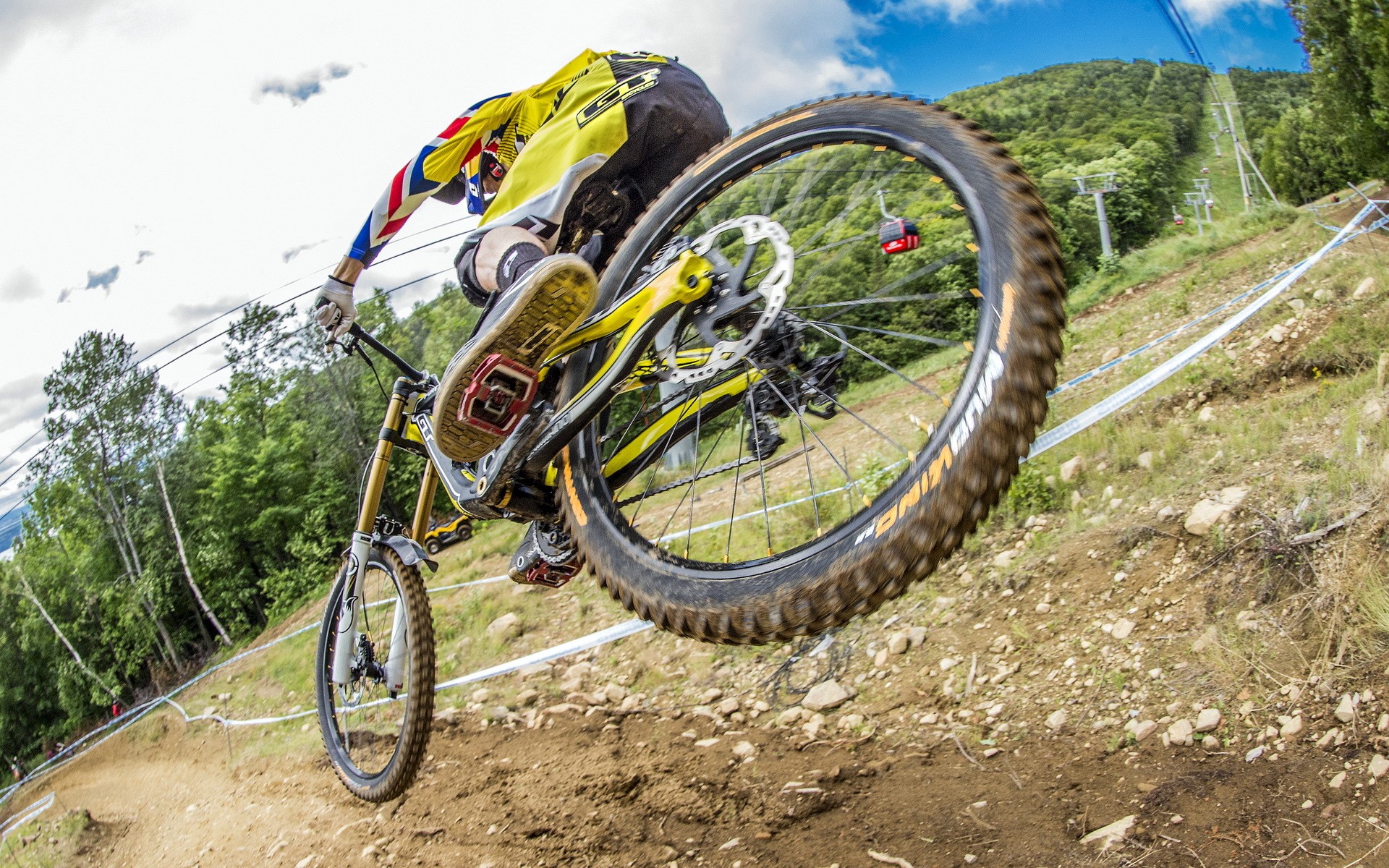 Mountain biker jumping on a dirt track HD Wallpaper