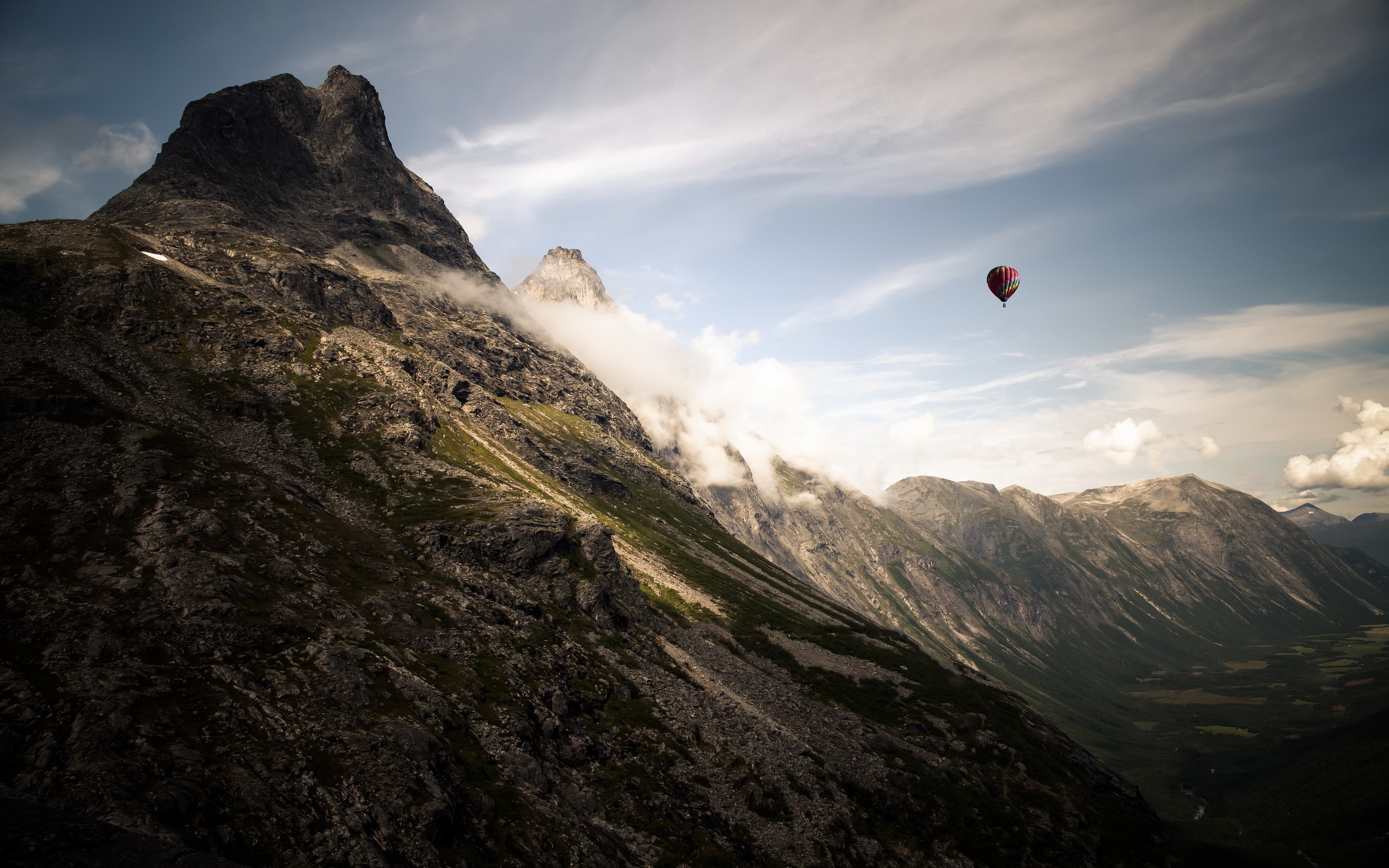 Hot air balloon over mountains HD Wallpaper
