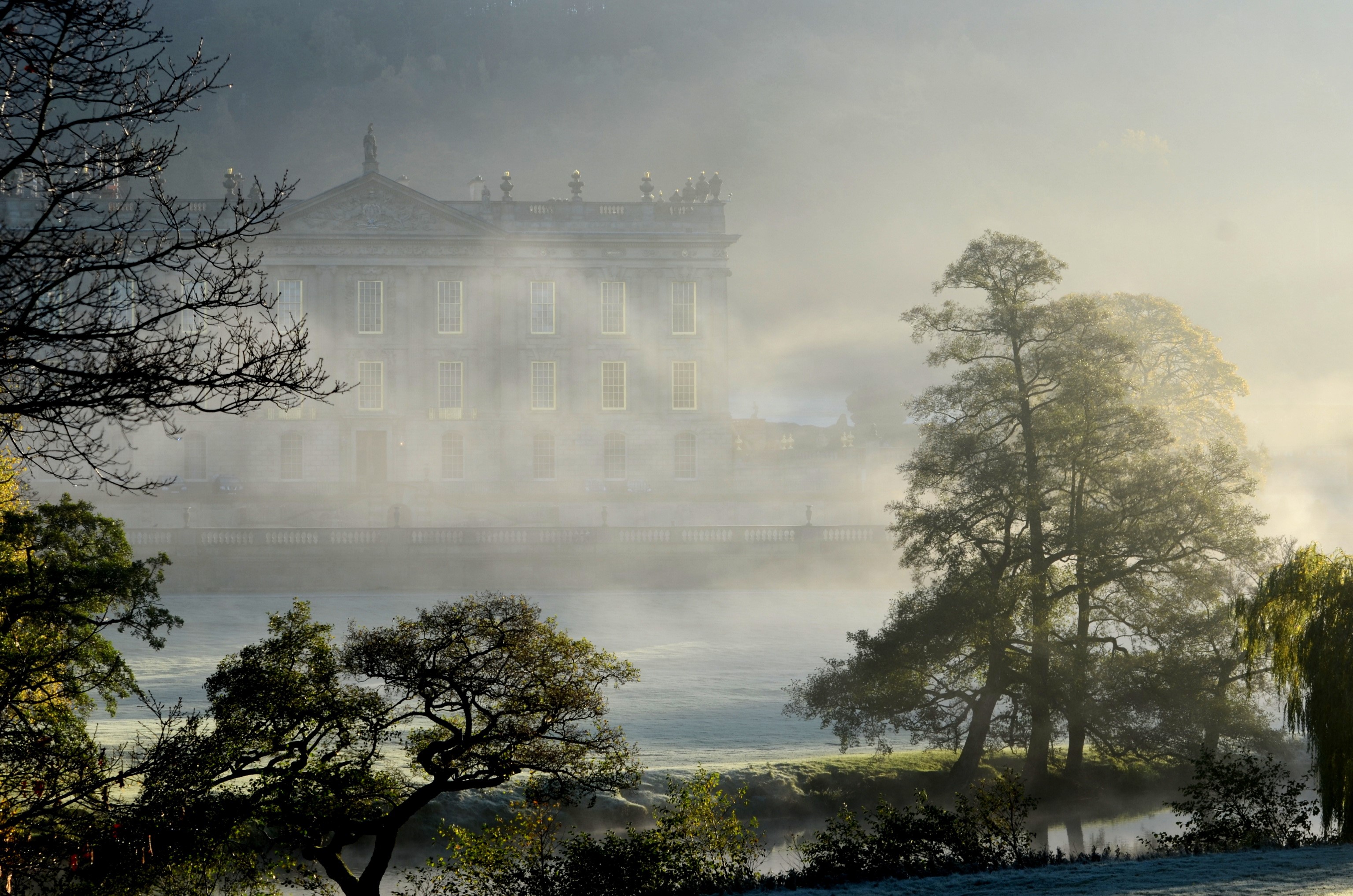Chatsworth House in the UK shrouded in fog HD Wallpaper