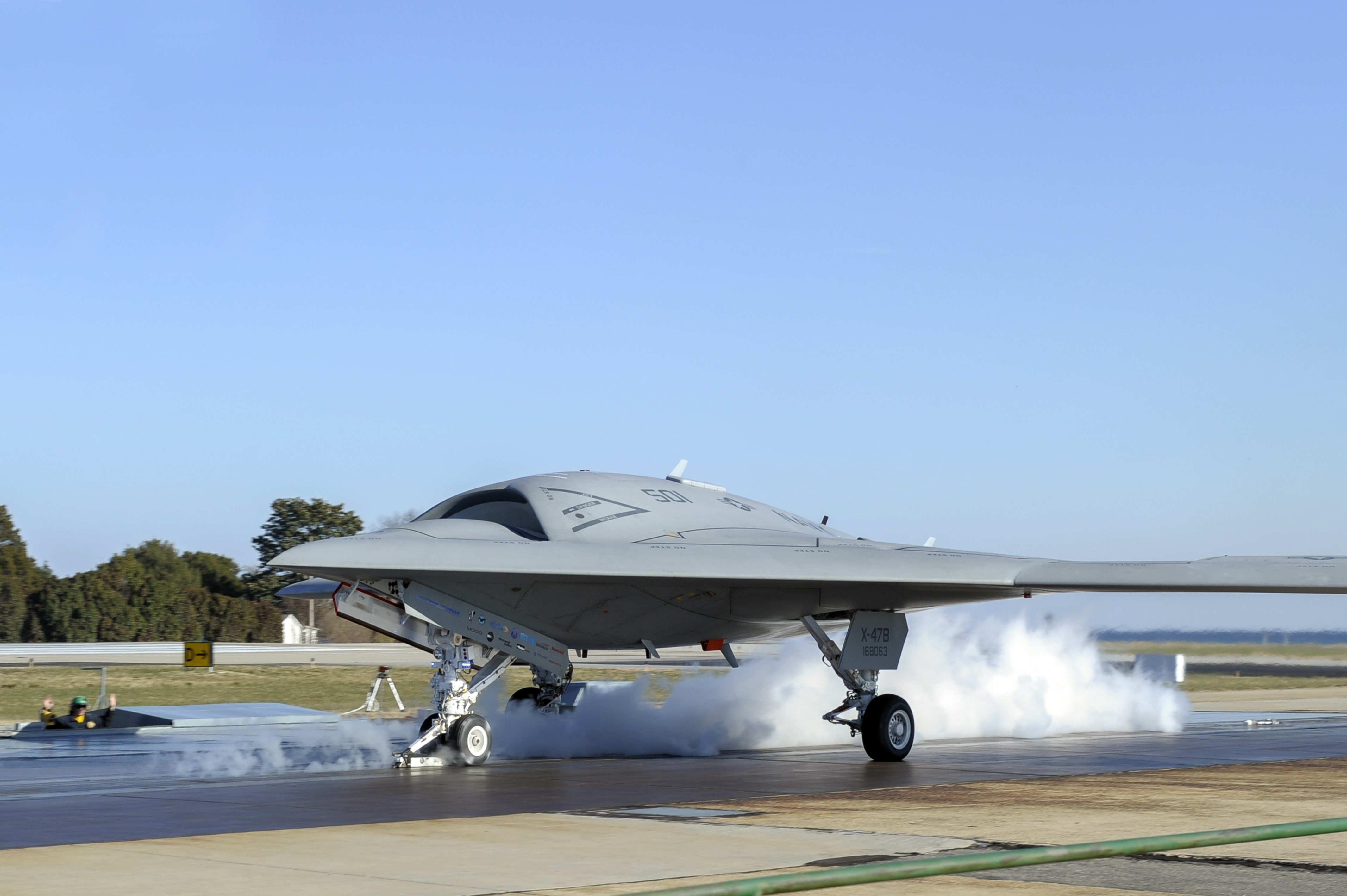 X-47B Pegasus drone on runway HD Wallpaper