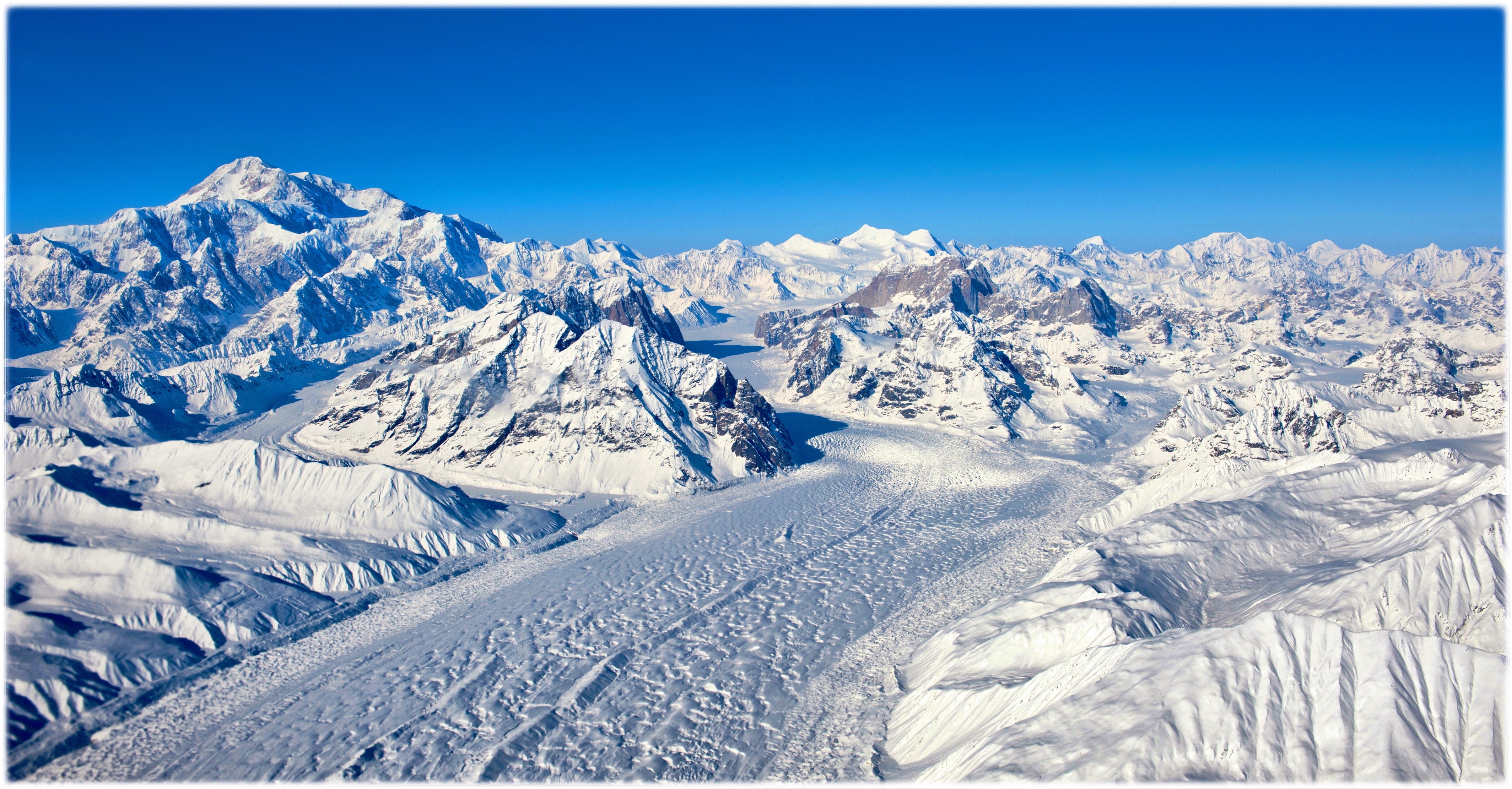 Snowy Mountains and Glaciers under Blue Sky HD Wallpaper