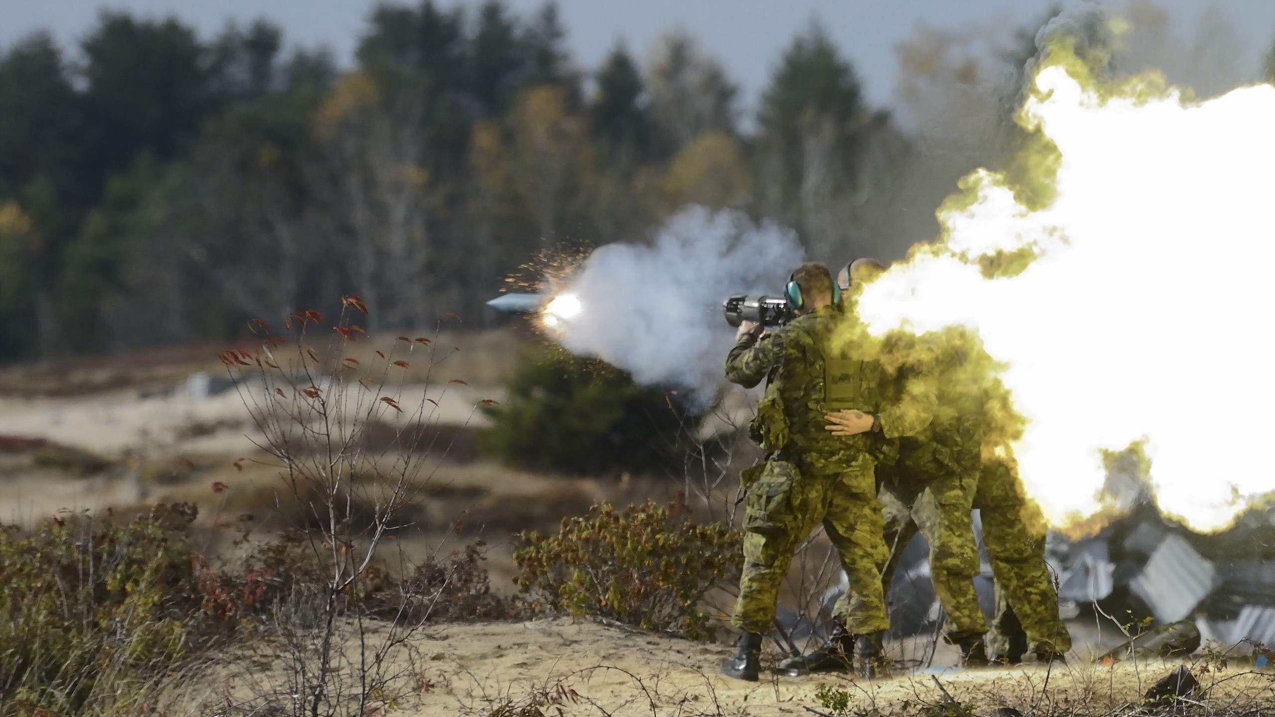 Soldiers firing a grenade launcher with explosion HD Wallpaper