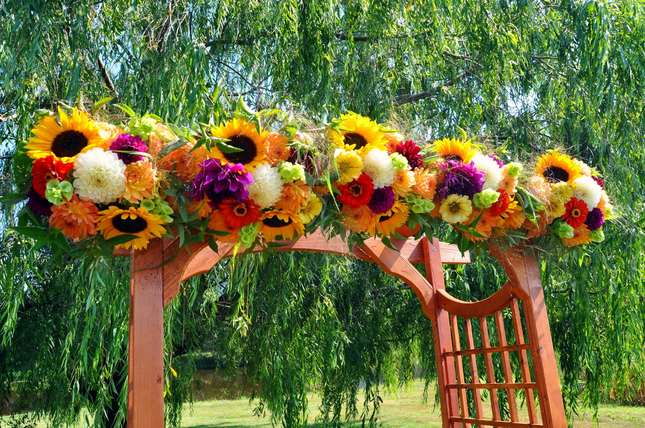 Flower arrangement on wooden arch HD Wallpaper