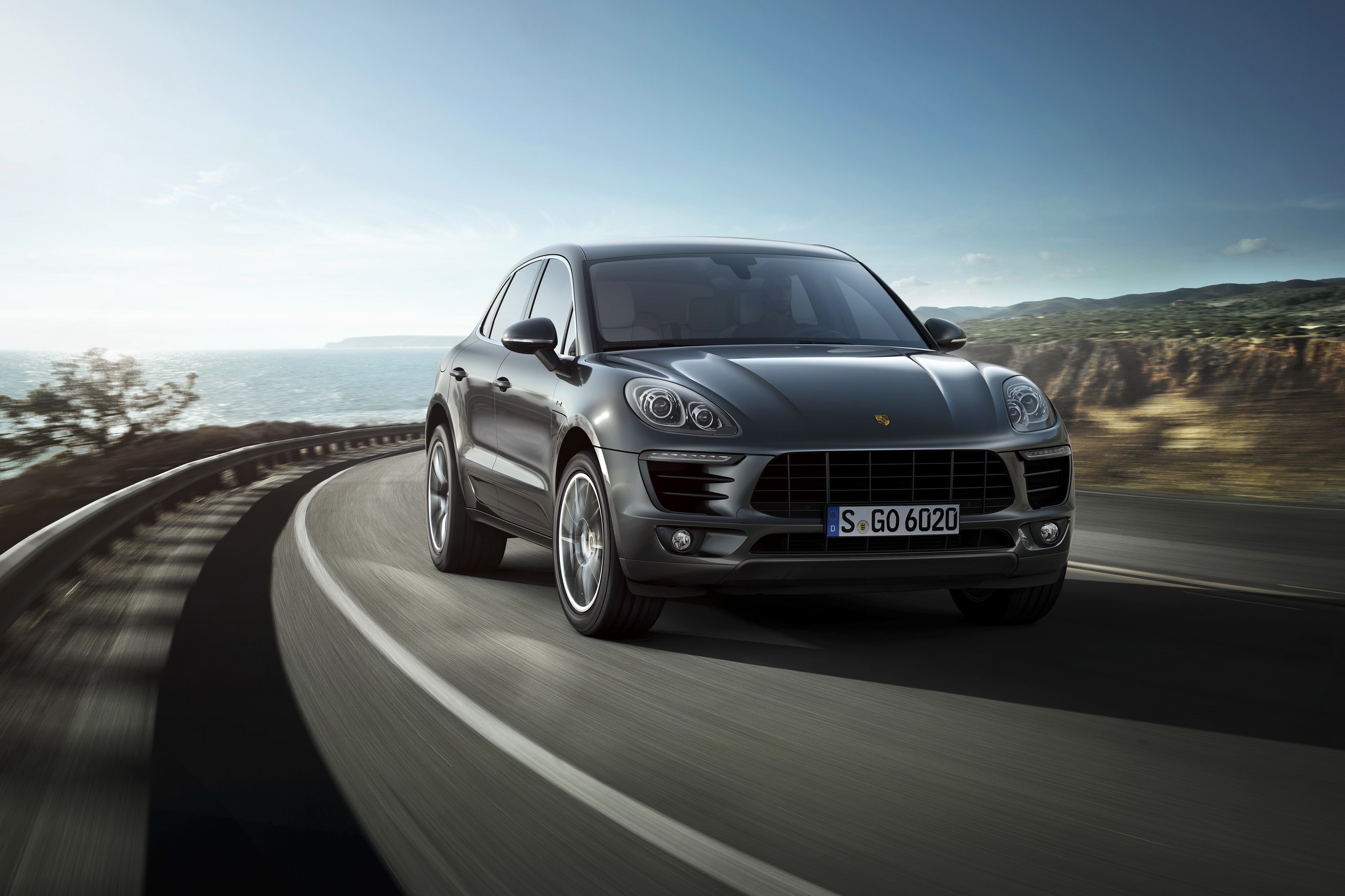 Grey Porsche Macan S Diesel driving on a coastal road HD Wallpaper