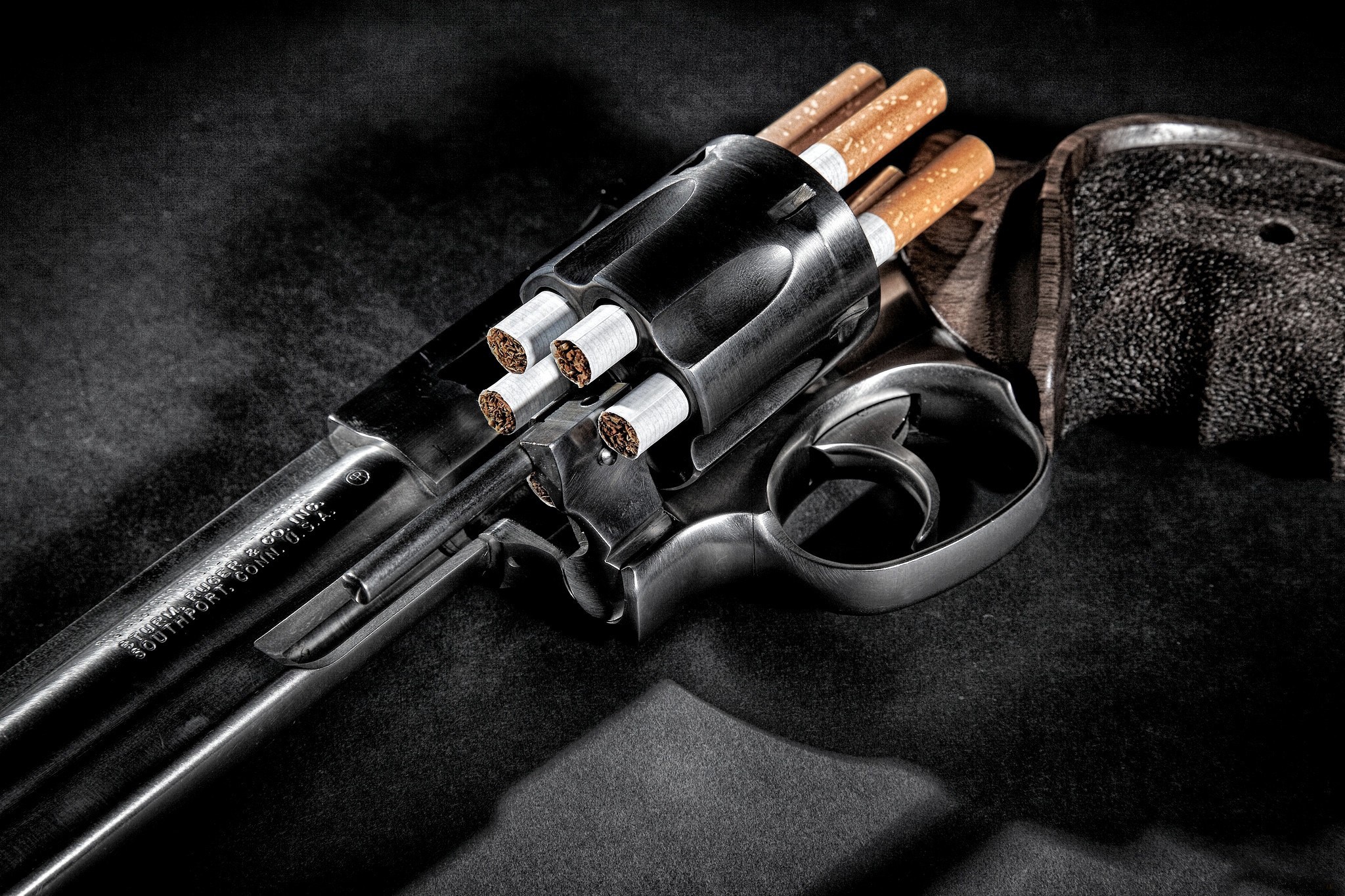 Revolver loaded with cigarettes HD Wallpaper