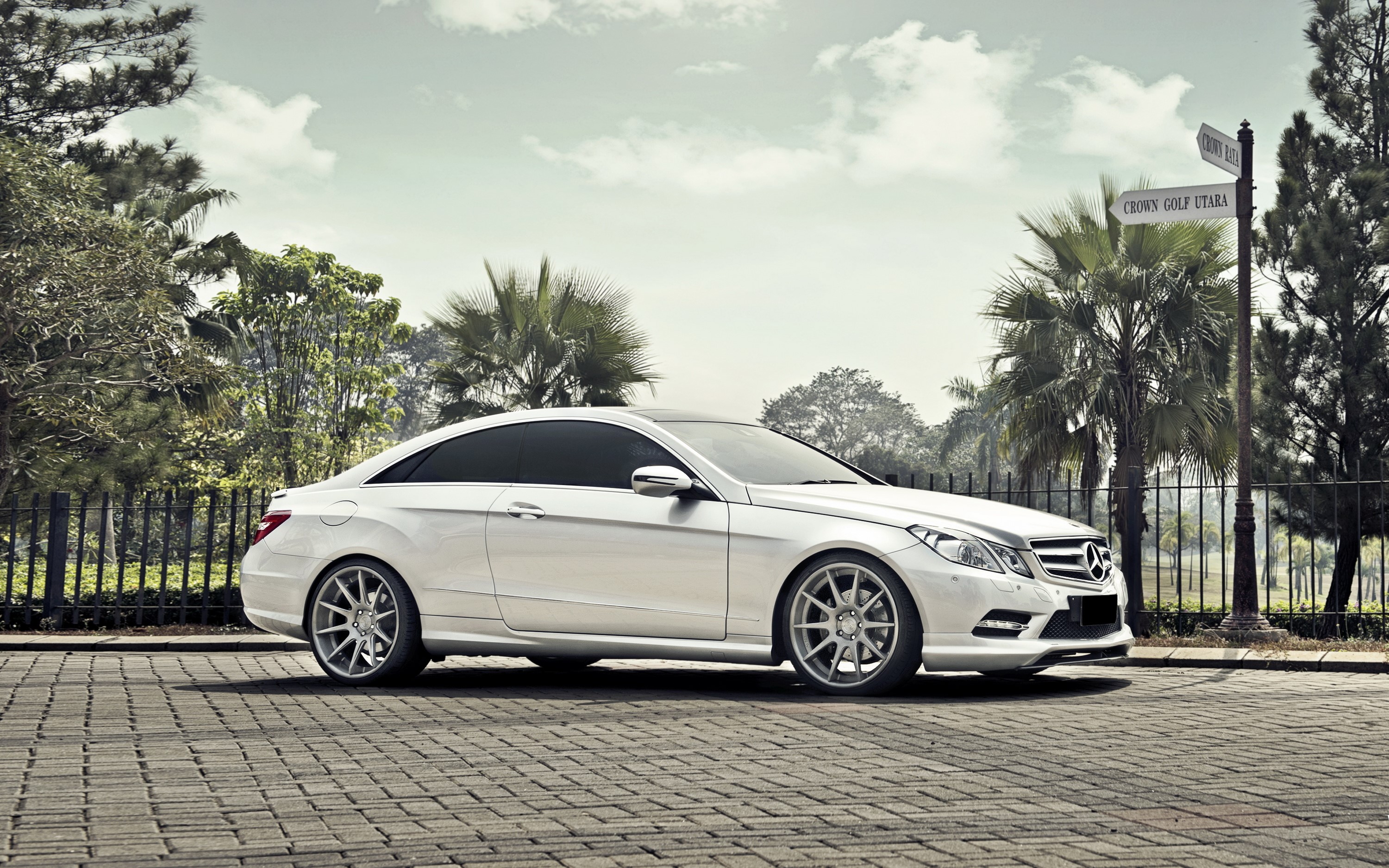 White Mercedes-Benz E-Class Coupe on Paved Road HD Wallpaper