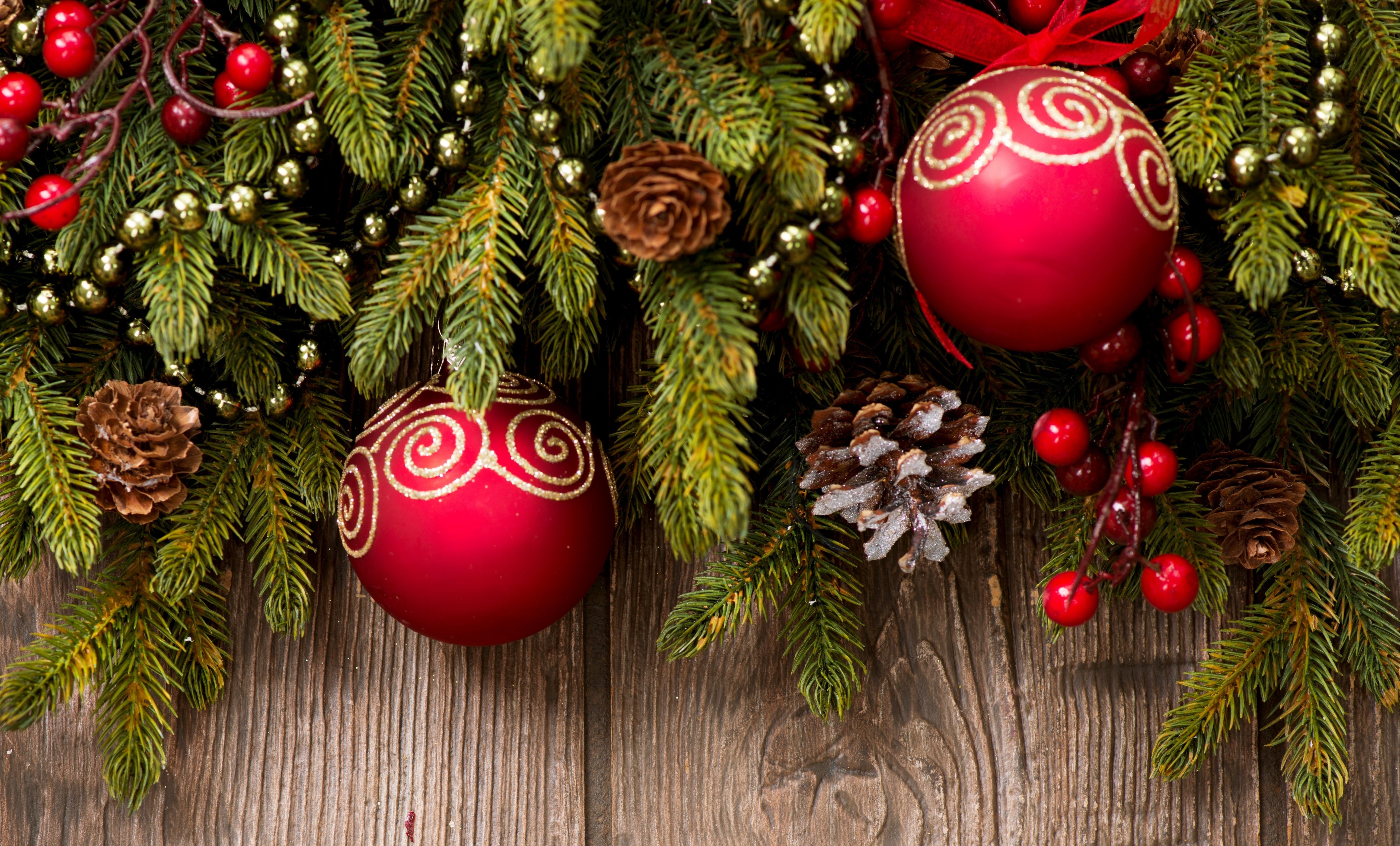 Christmas tree branches with ornaments and pine cones HD Wallpaper