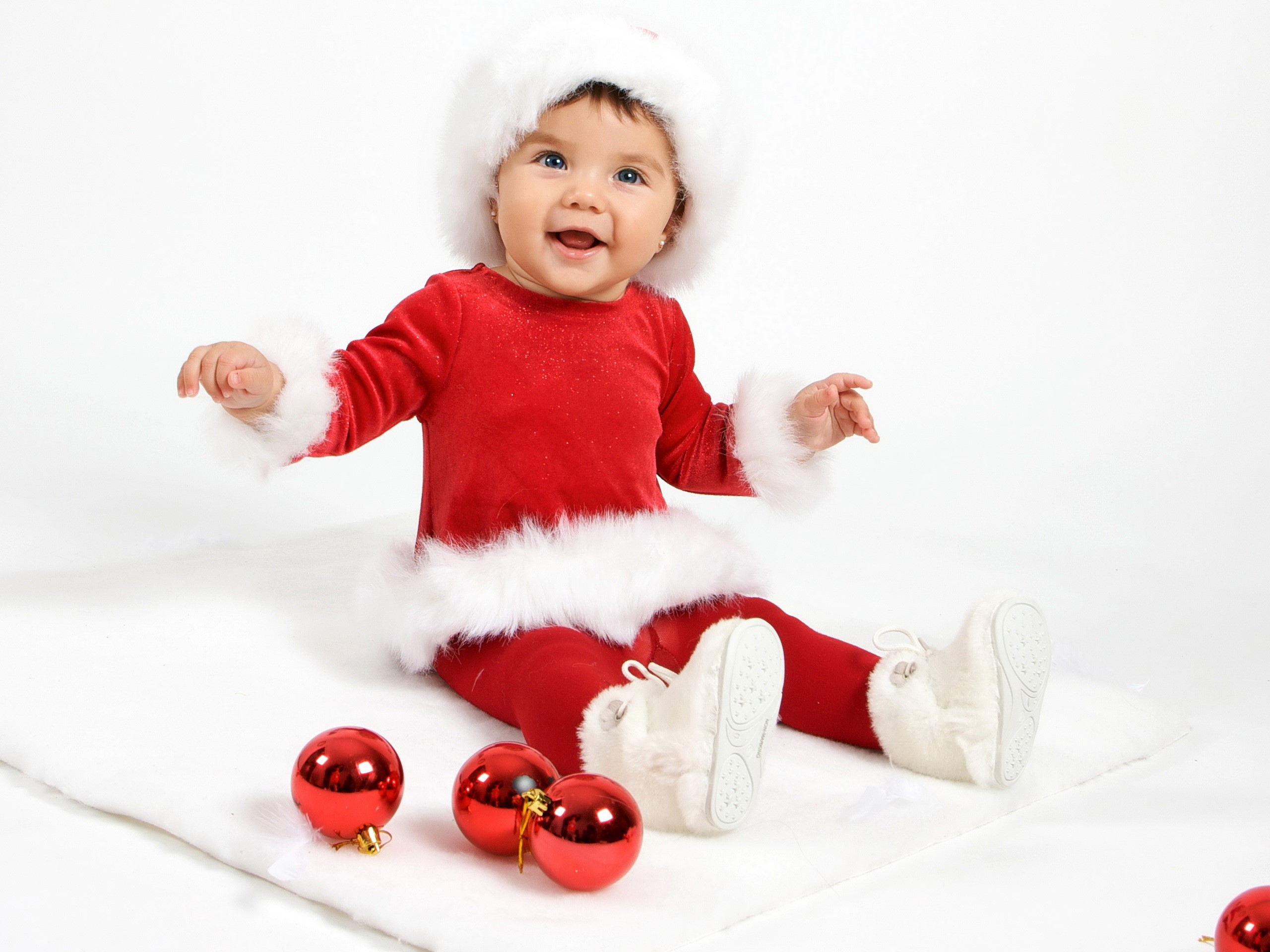 Baby in Santa costume with Christmas ornaments HD Wallpaper