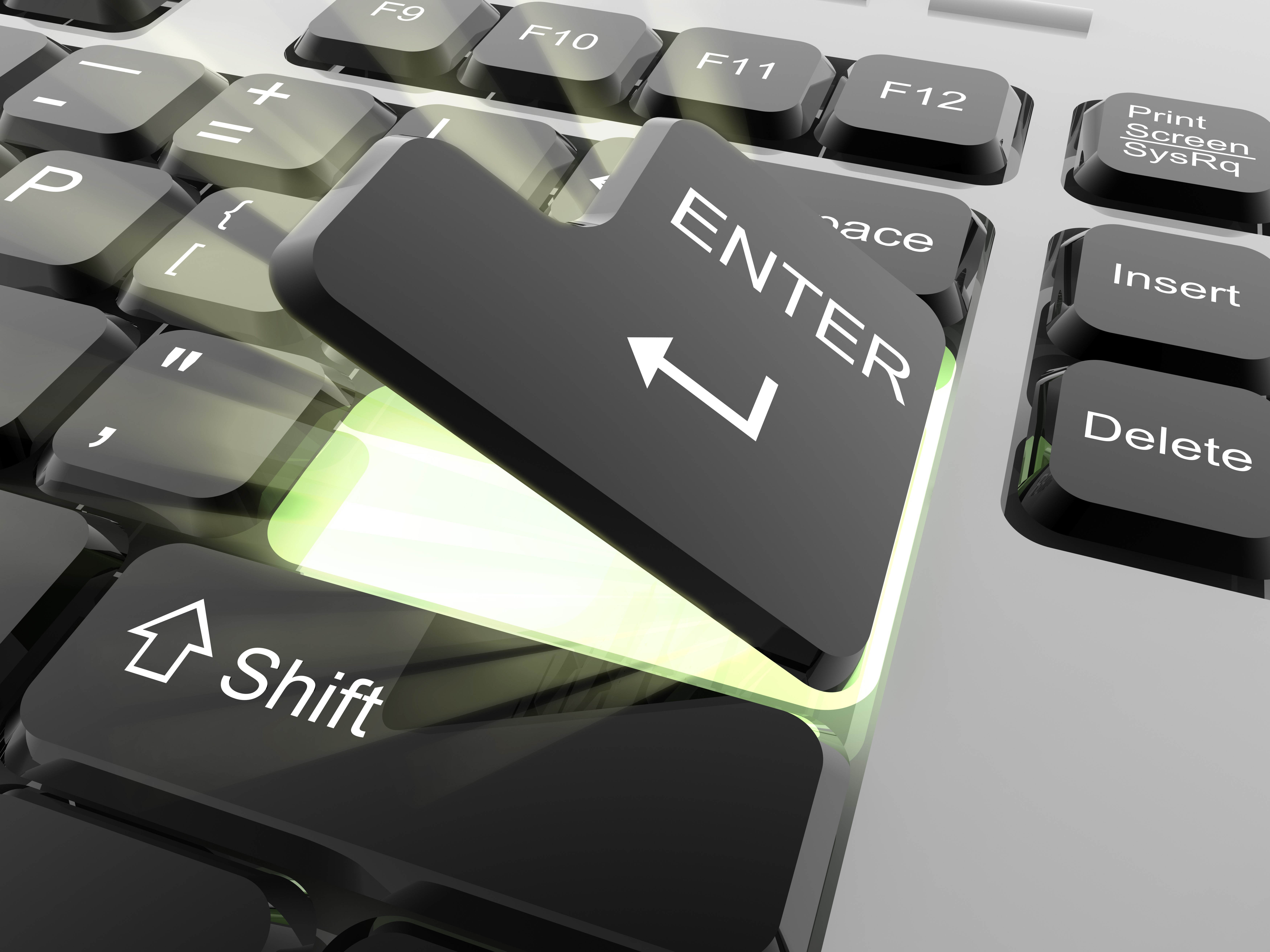 Close-up of a glowing Enter key on a keyboard HD Wallpaper