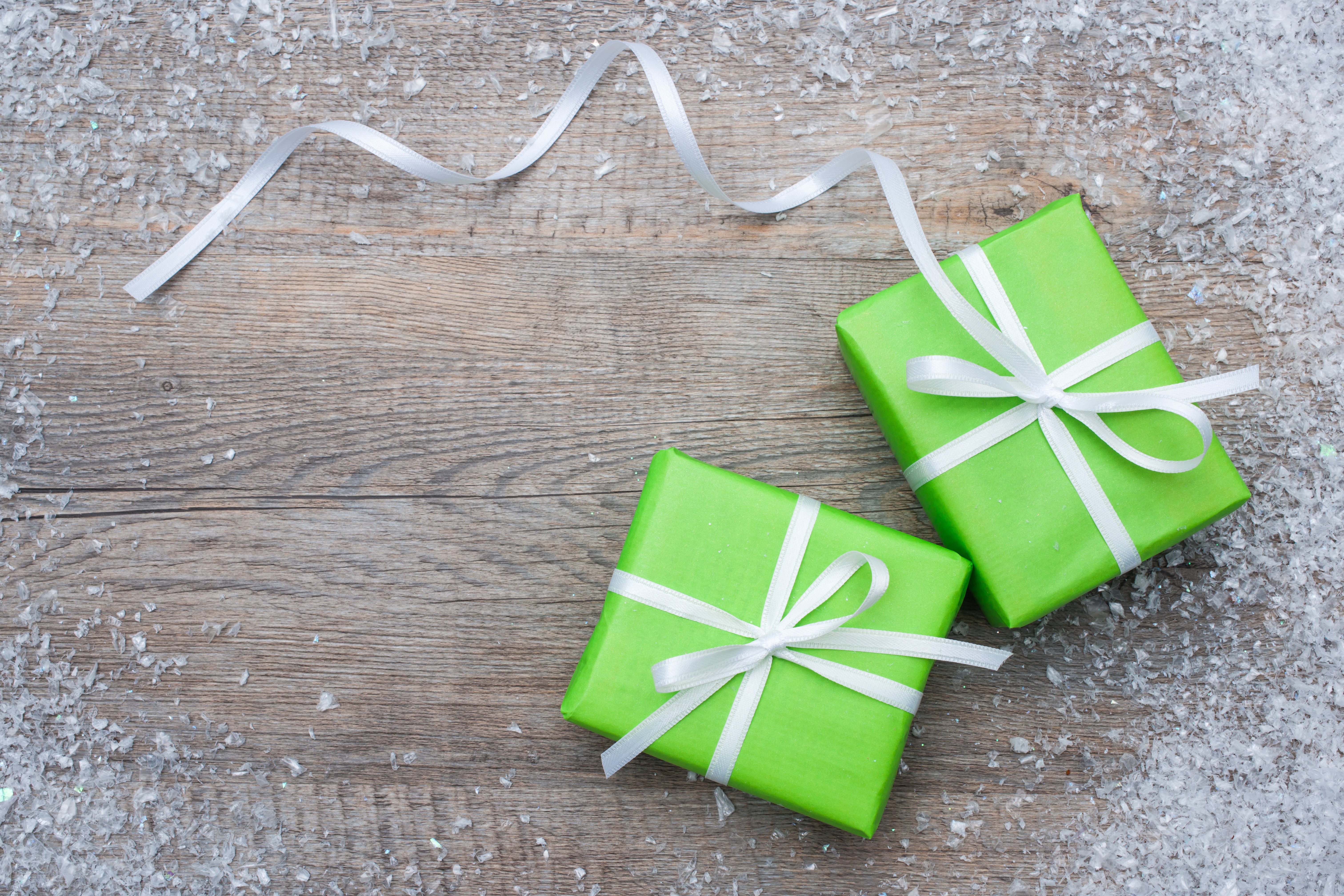Christmas Gifts with Snow and Ribbon on Wood HD Wallpaper